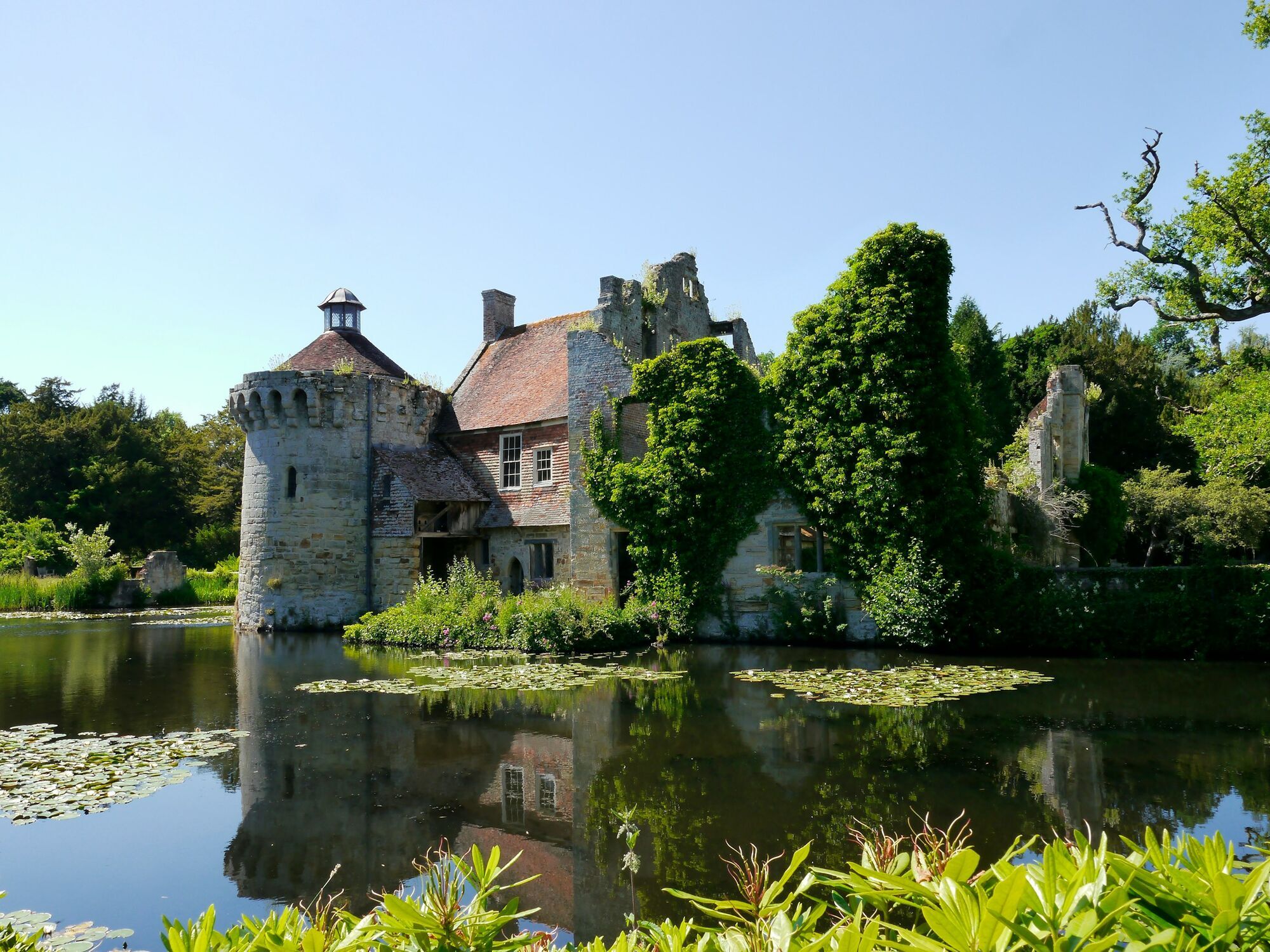 Historic Kent building surrounded by water and greenery