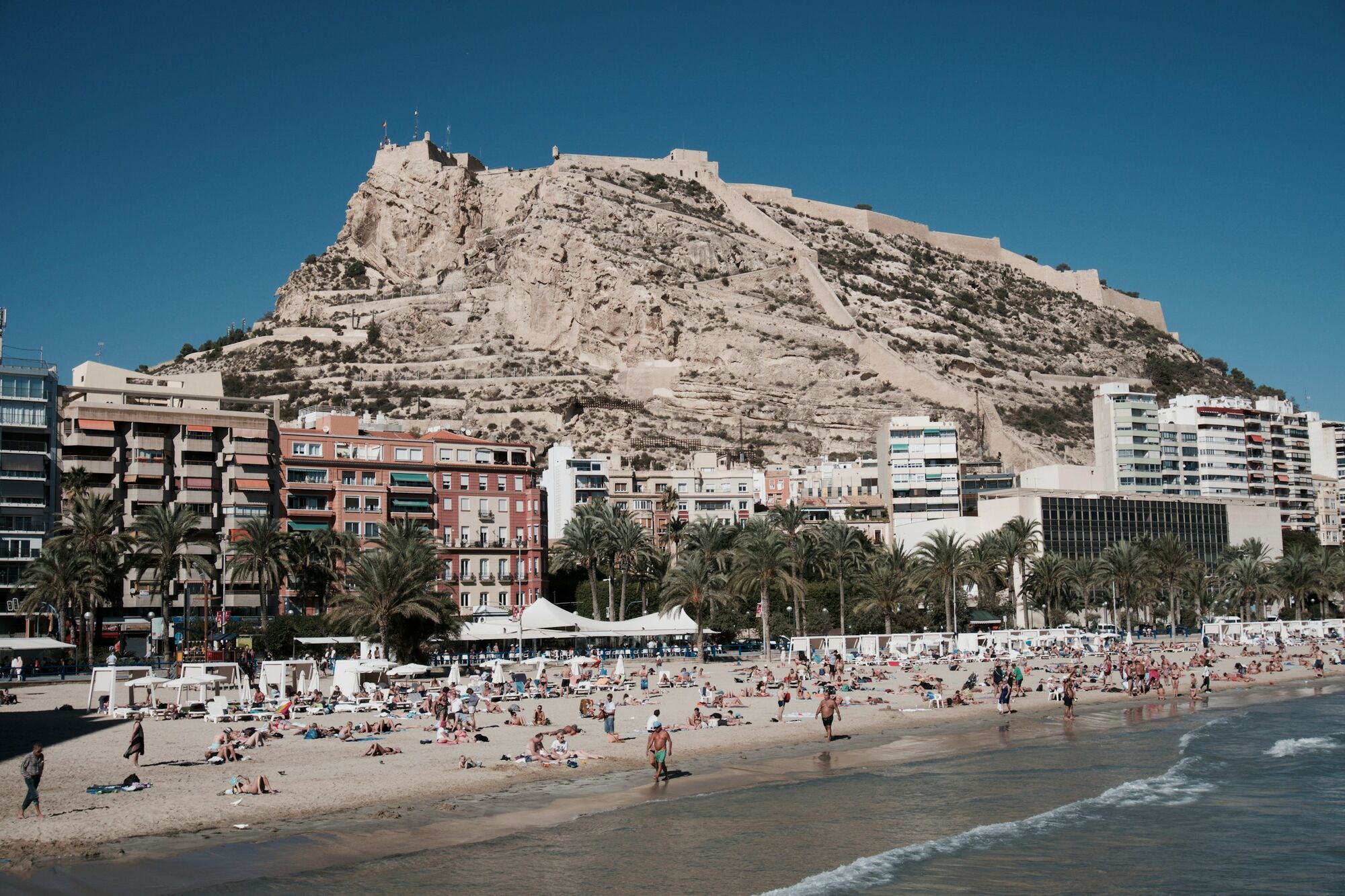 Alicante beach with Santa Bárbara Castle above the city