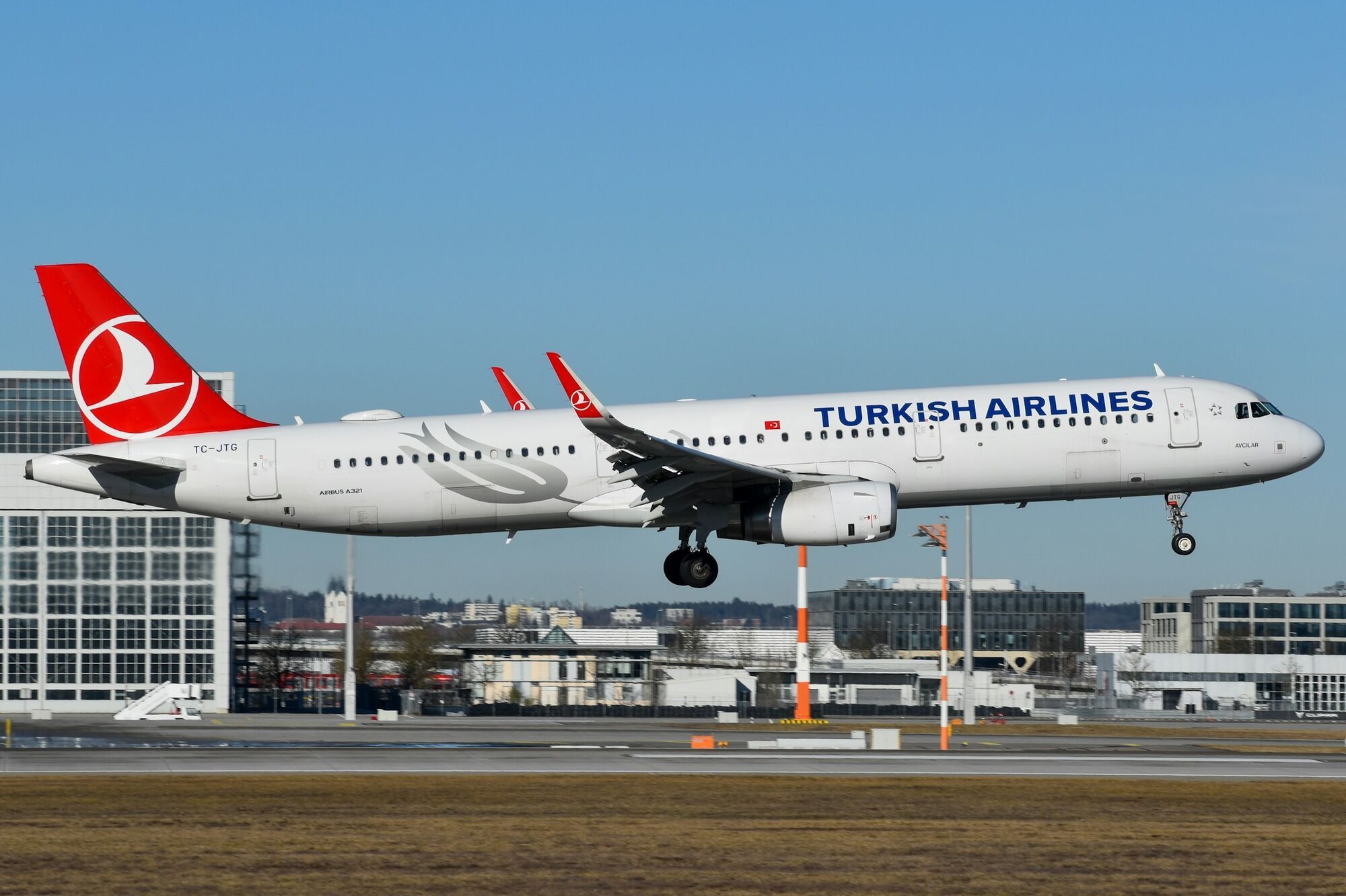 Turkish Airlines aircraft landing at an airport