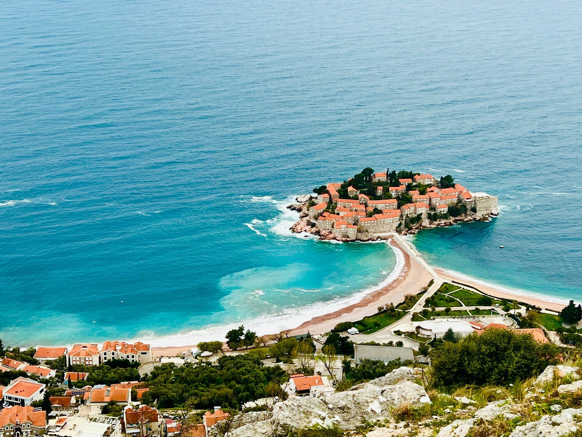 Sveti Stefan island and beach seen from the Montenegrin coast