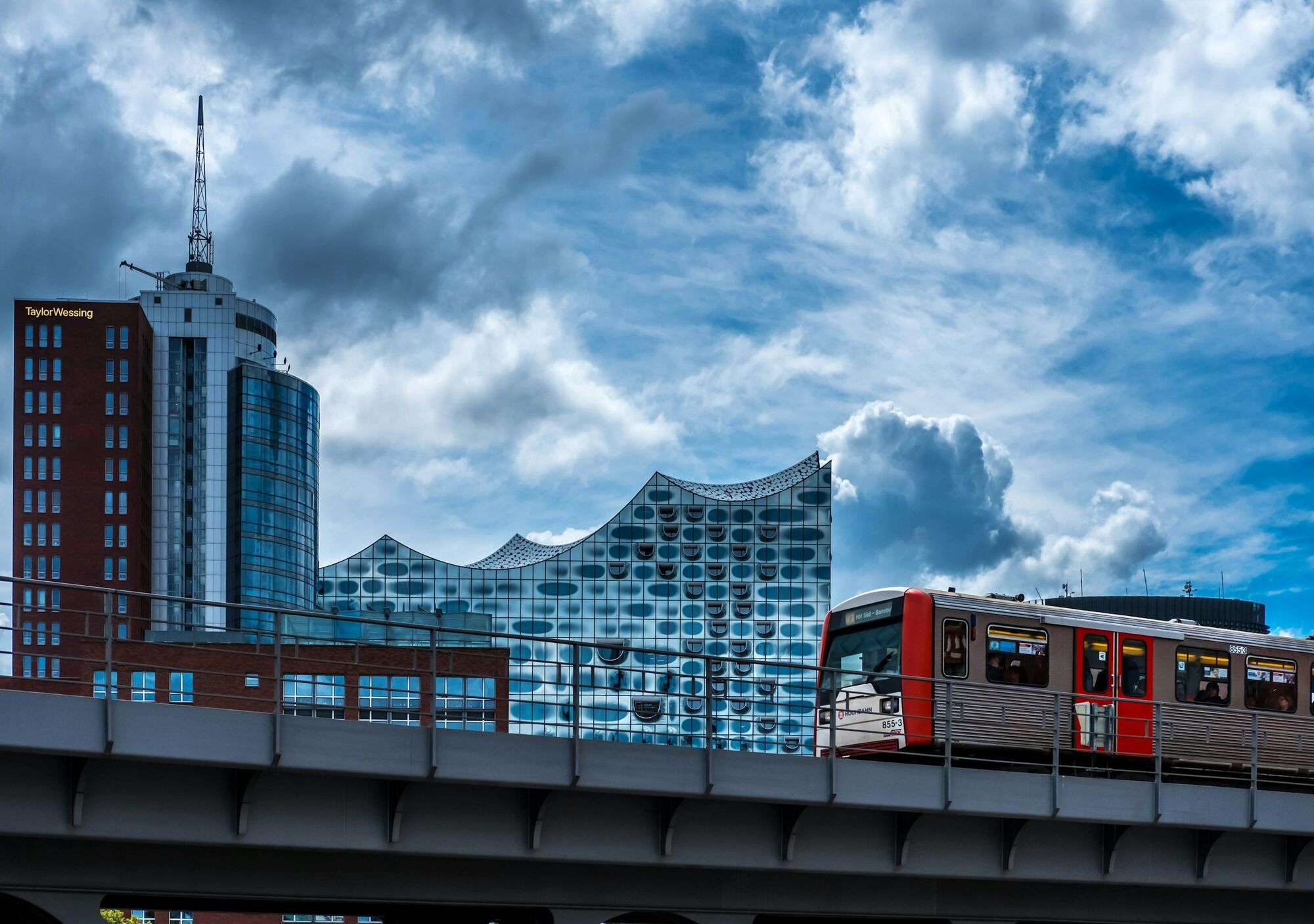 Hamburg train passing the Elbphilharmonie on an elevated track