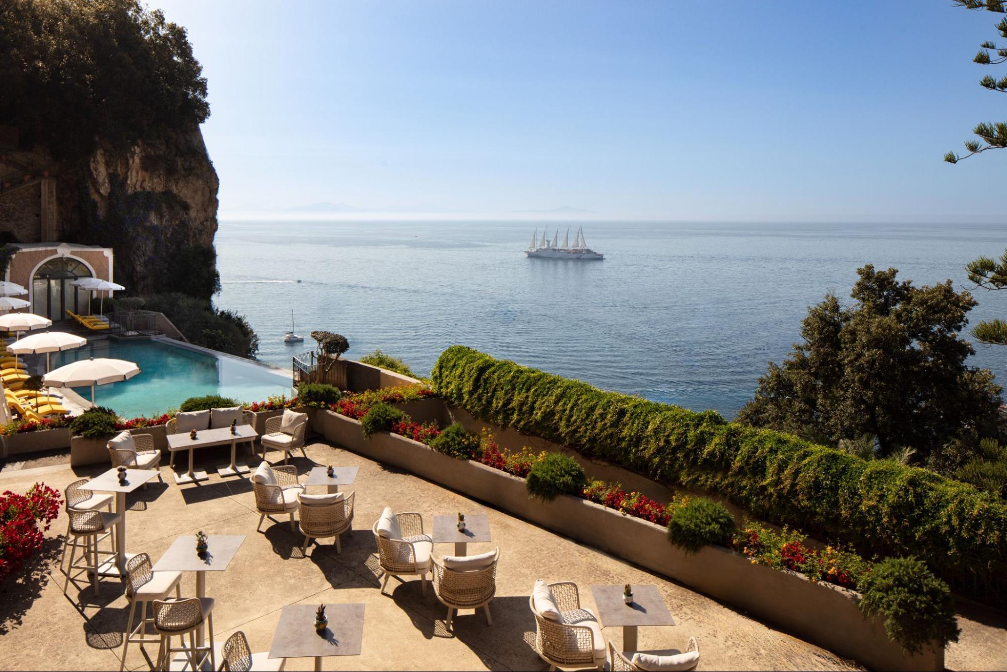 Terrace pool bar at Anantara Convento di Amalfi Grand Hotel overlooking the sea