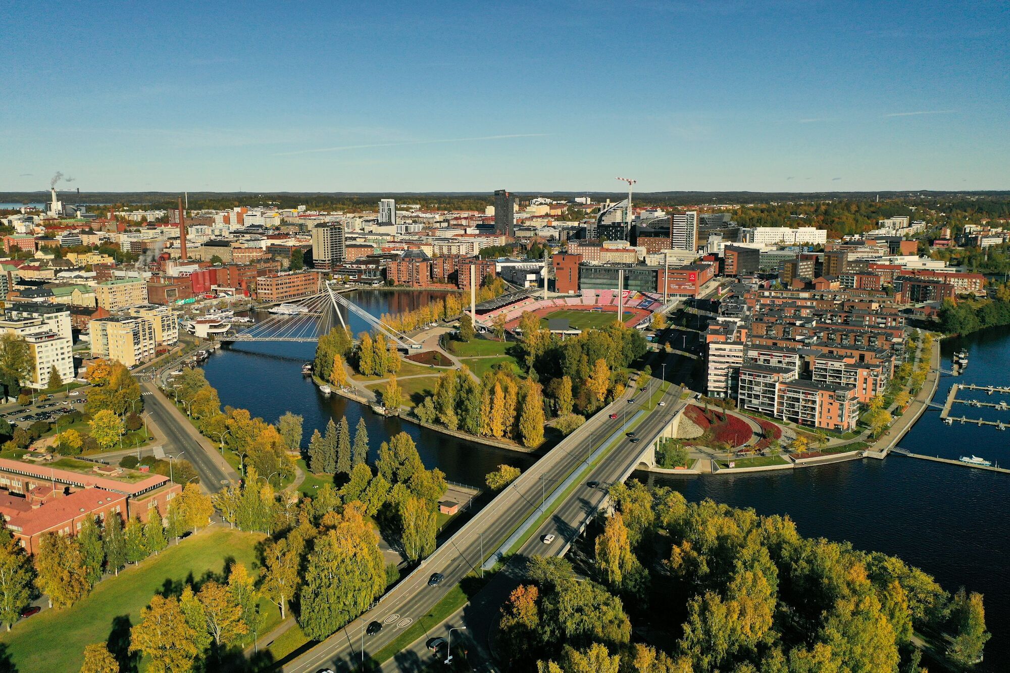 Aerial view of Tampere with lakes, bridges and city buildings