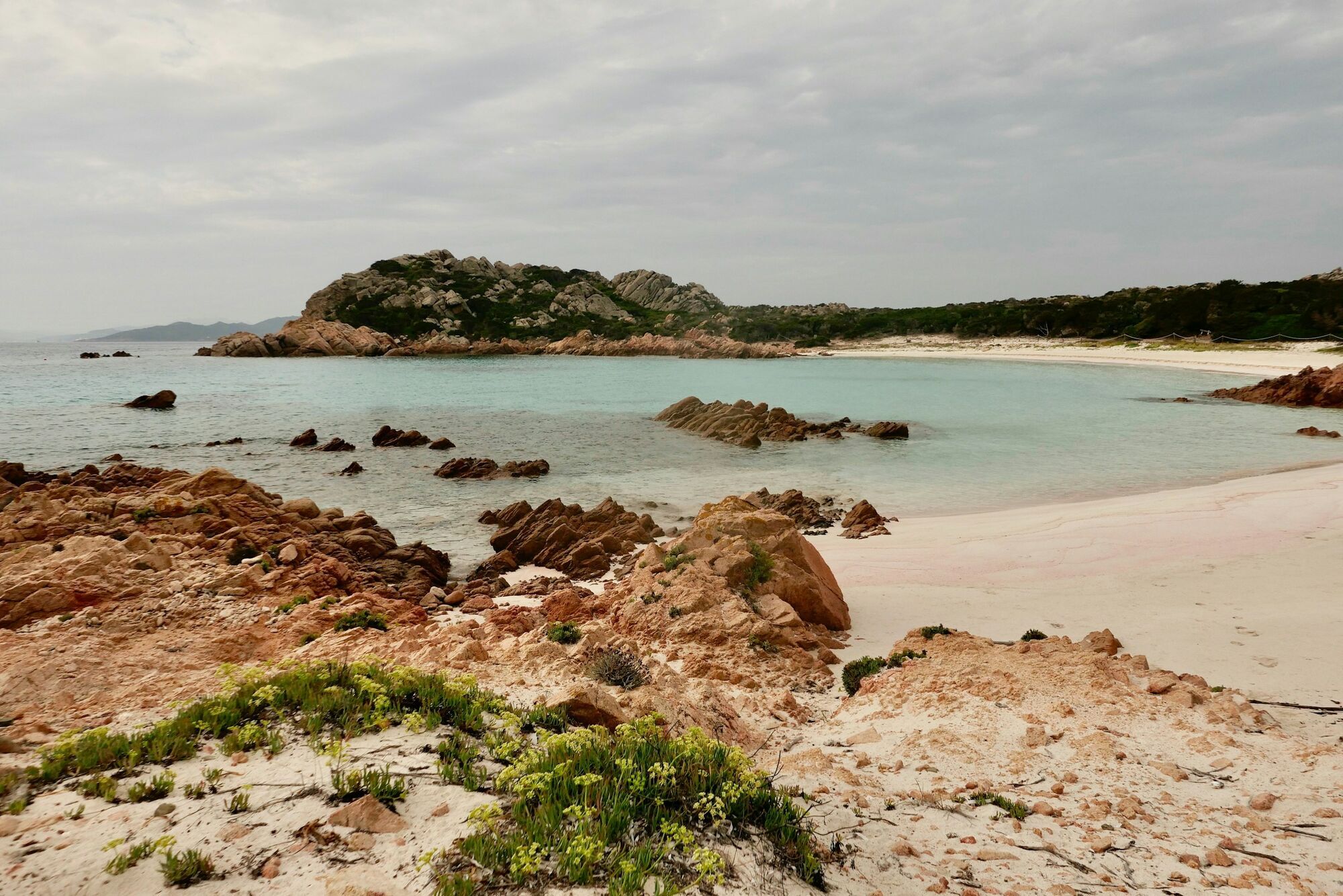 Pale pink sand beach and rocky coastline on Budelli island in Sardinia