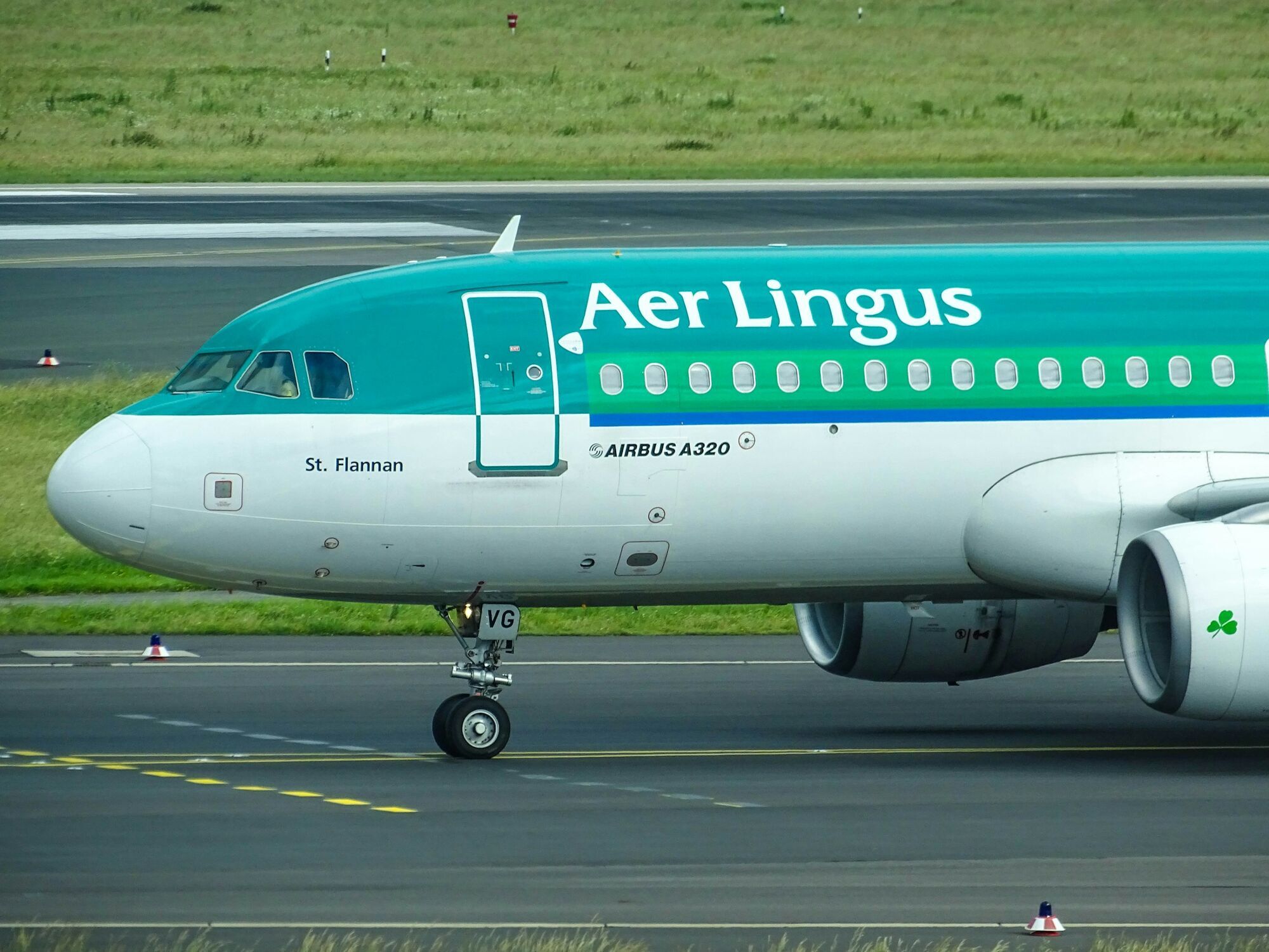 Aer Lingus aircraft taxiing on an airport runway