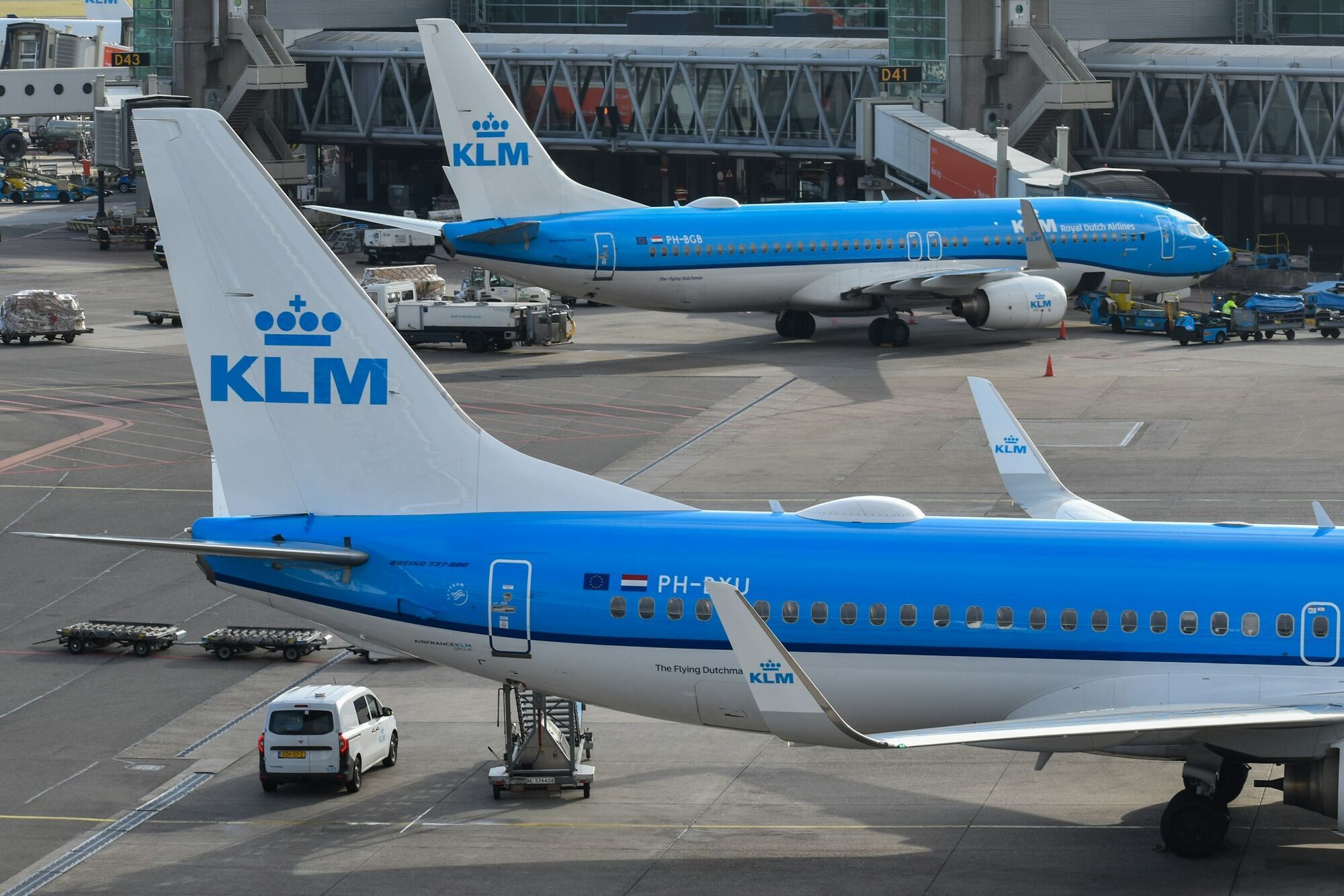 KLM aircraft parked at Amsterdam Schiphol Airport gates