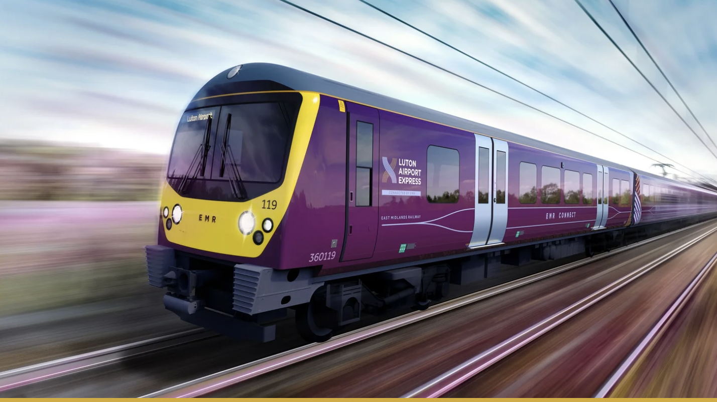 Luton Airport Express train travelling on railway tracks