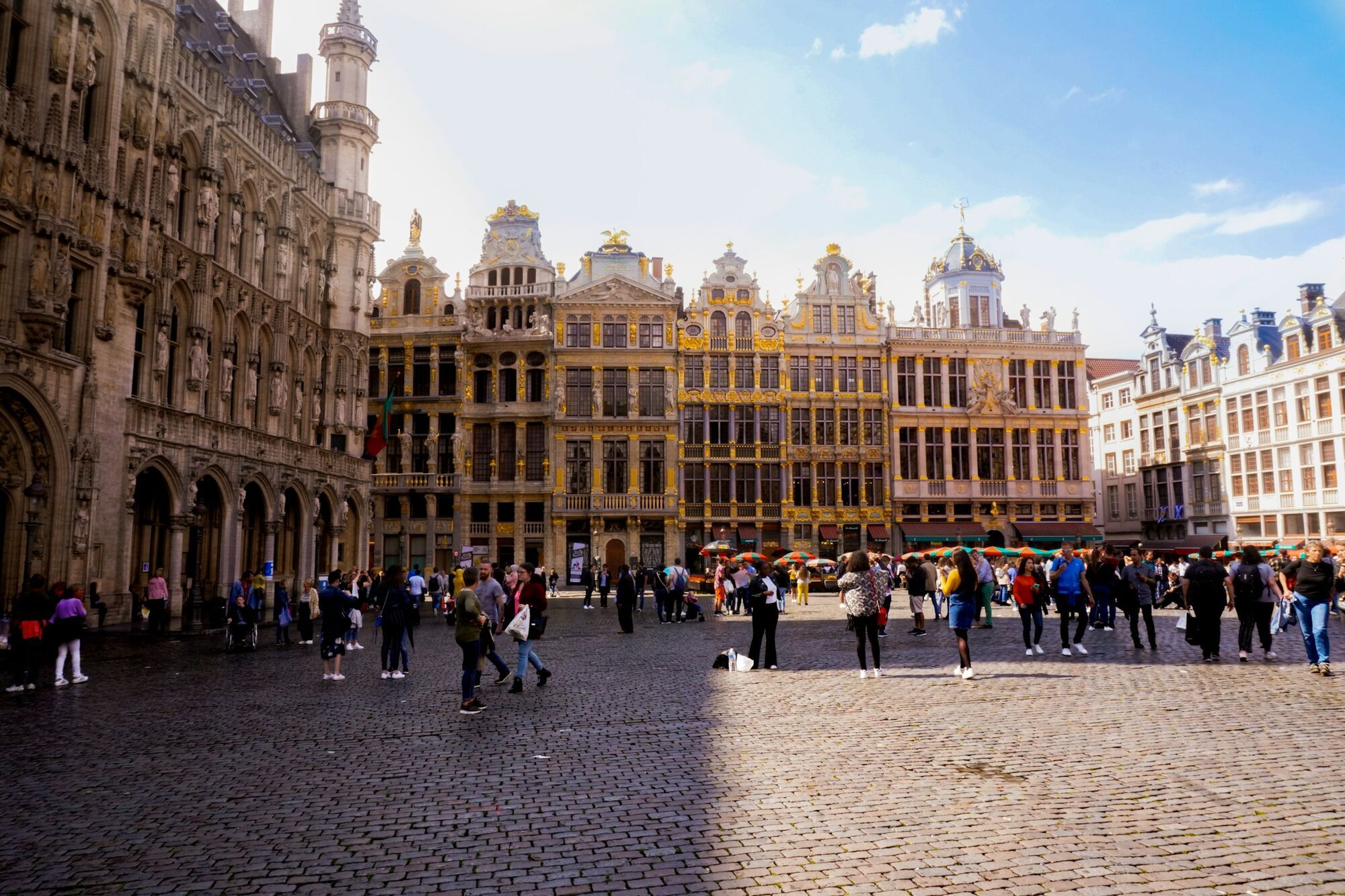Tourists walking through Grand Place in Brussels