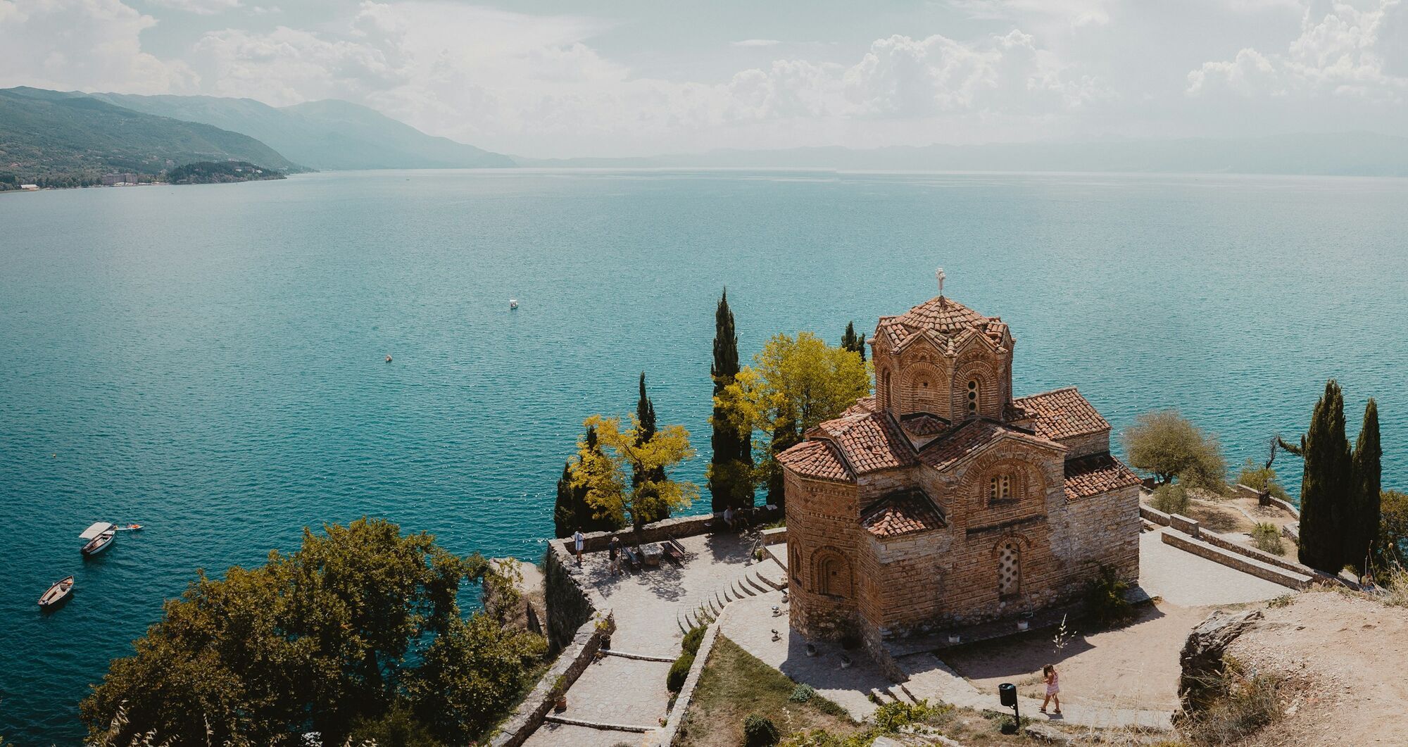 Lake Ohrid with a historic church in Pogradec region