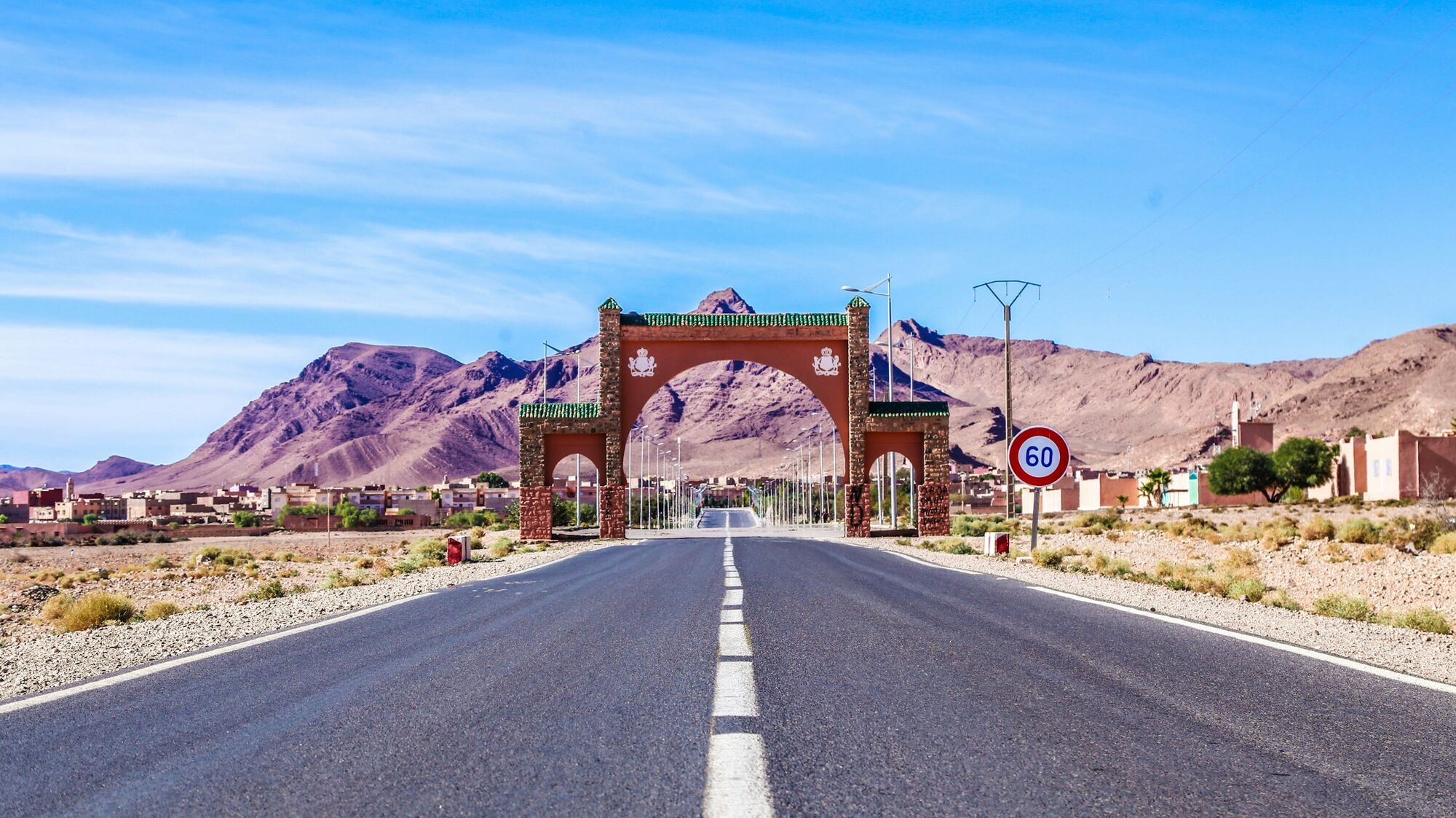 Road entrance in Morocco with mountains in the background