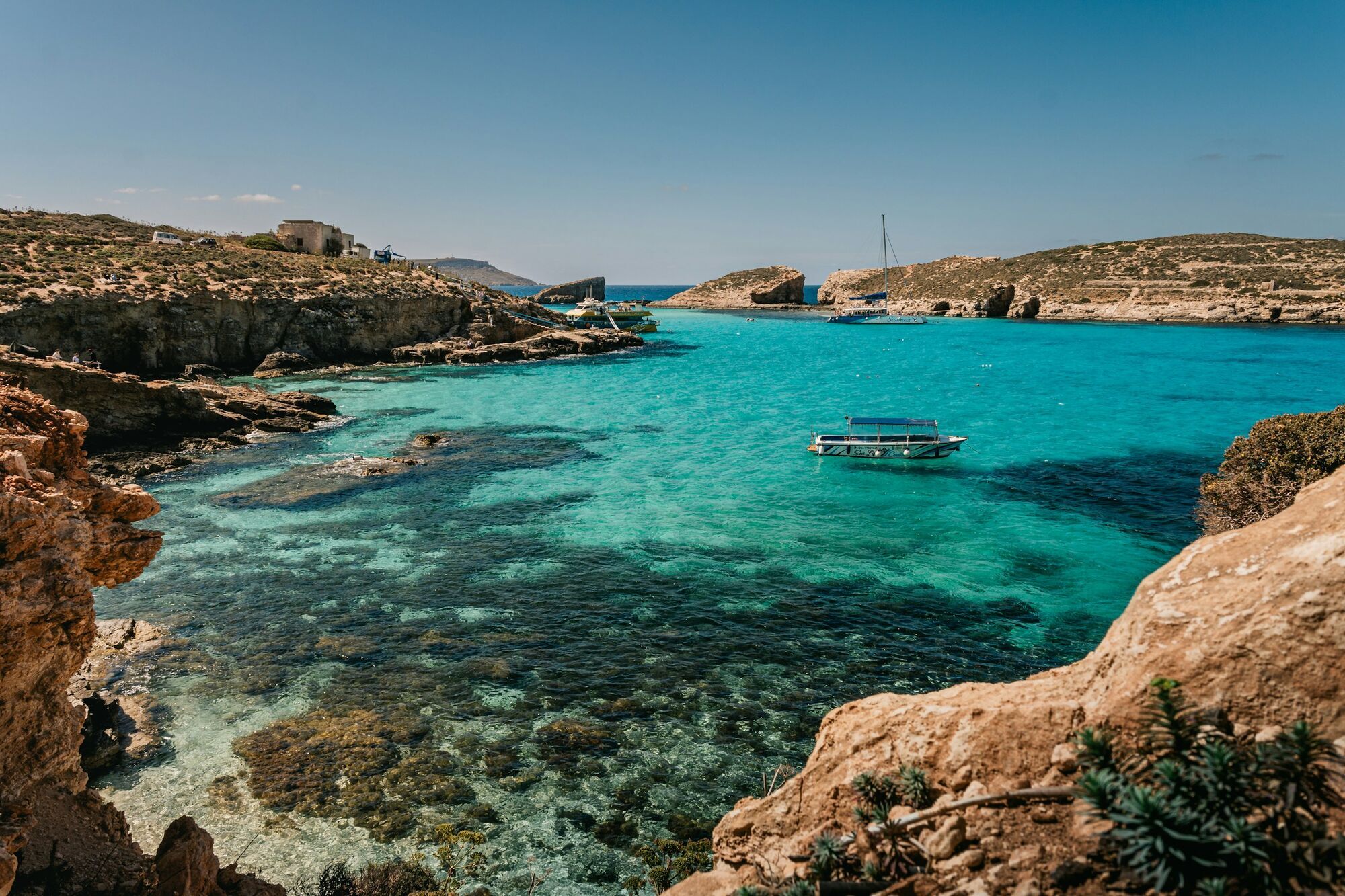 Clear blue water and rocky coastline in Malta