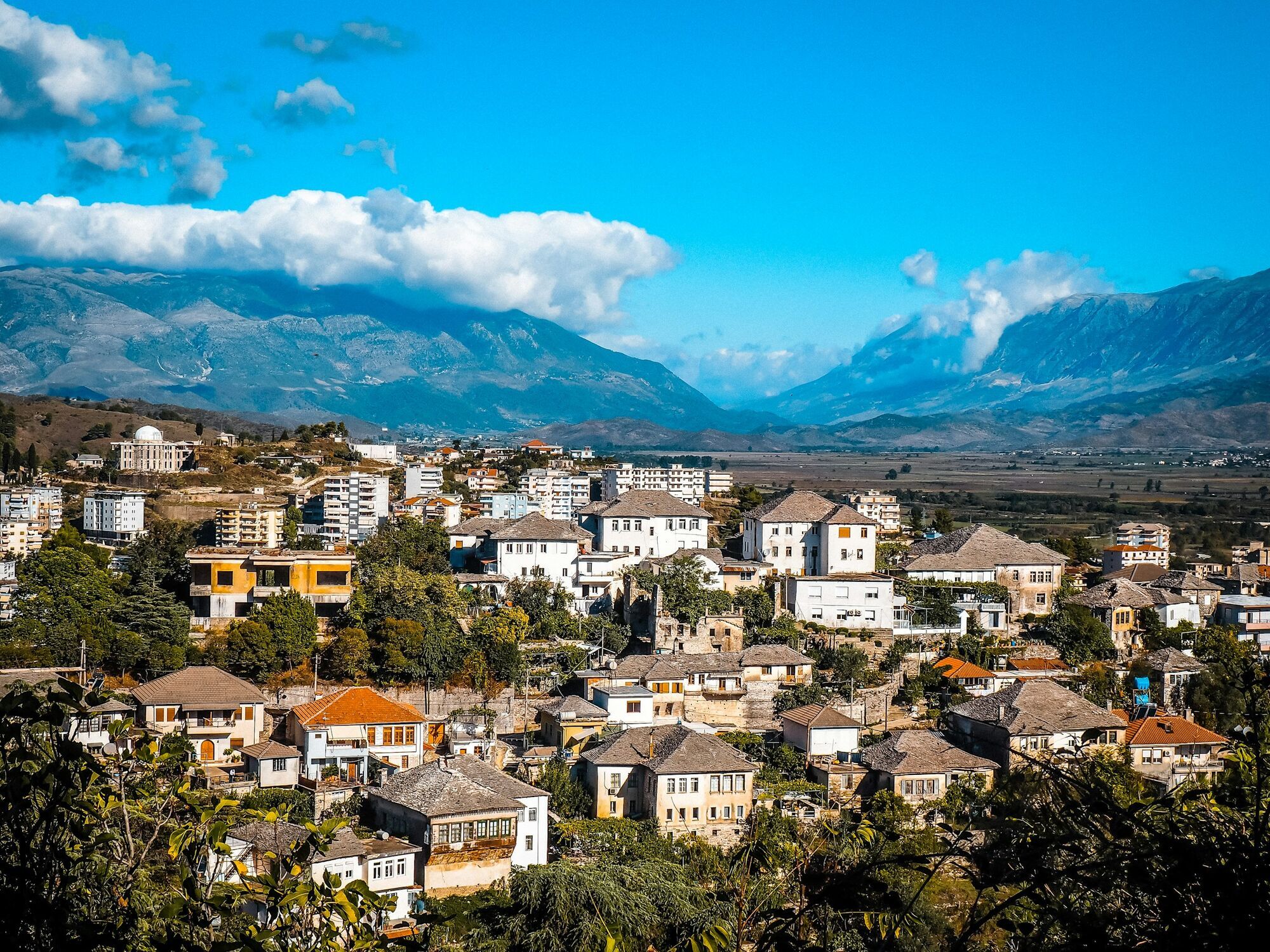 Gjirokastër rooftops and mountains in southern Albania