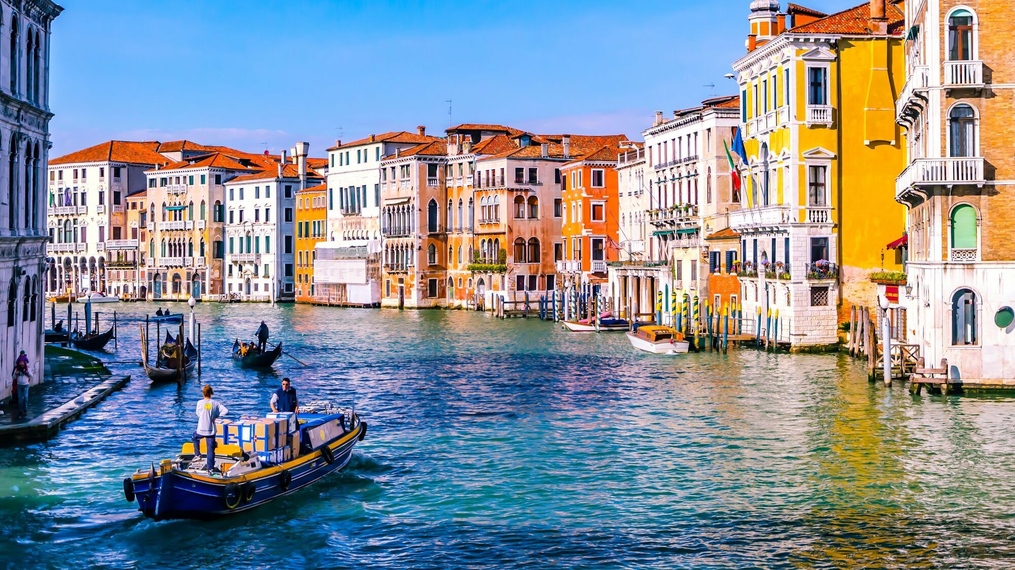 Colourful buildings and boats along the Grand Canal in Venice