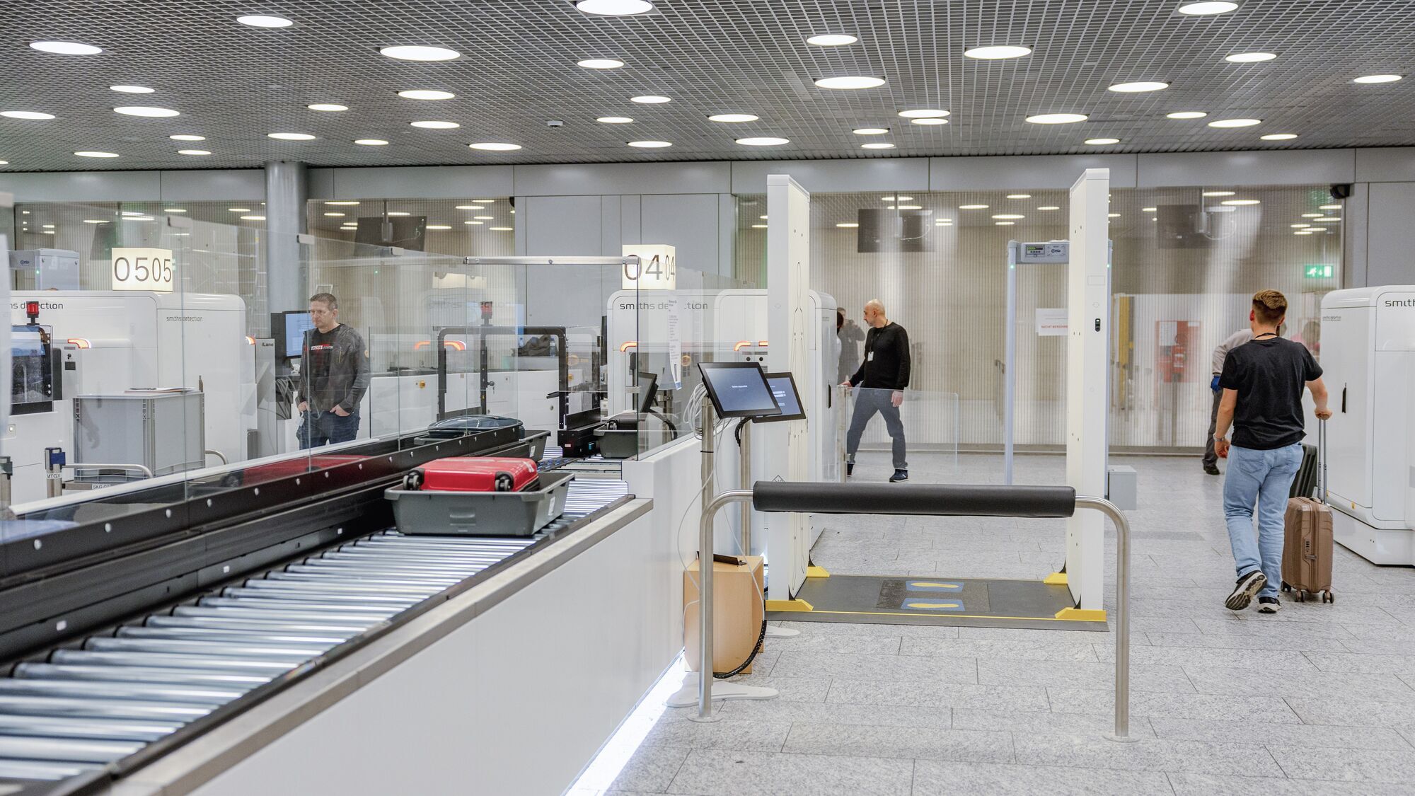 Passengers passing through Zurich Airport security