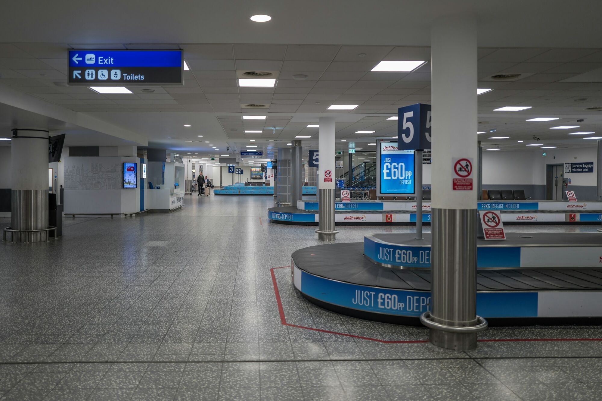 Empty baggage reclaim area inside a UK airport
