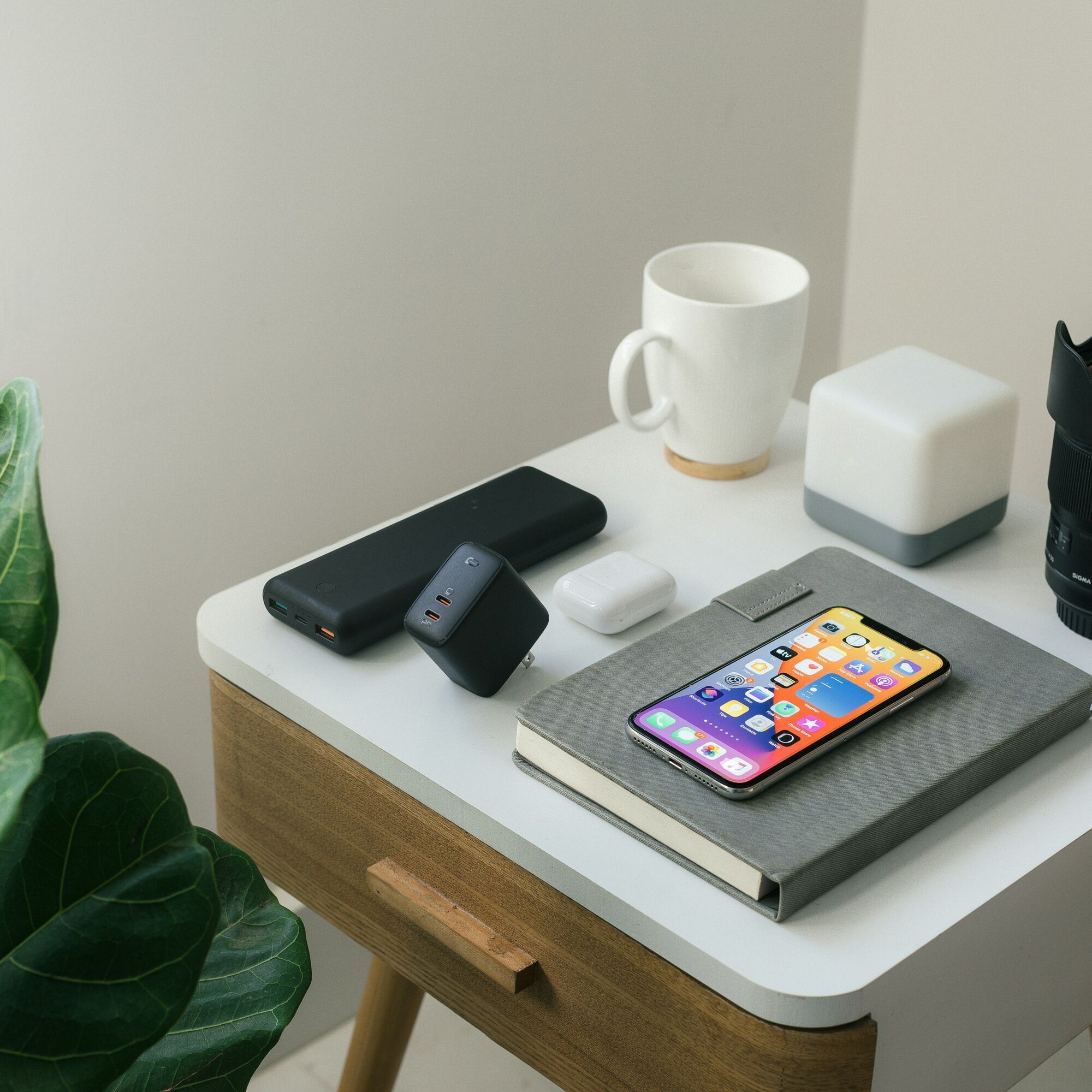 Travel essentials including a power bank and smartphone