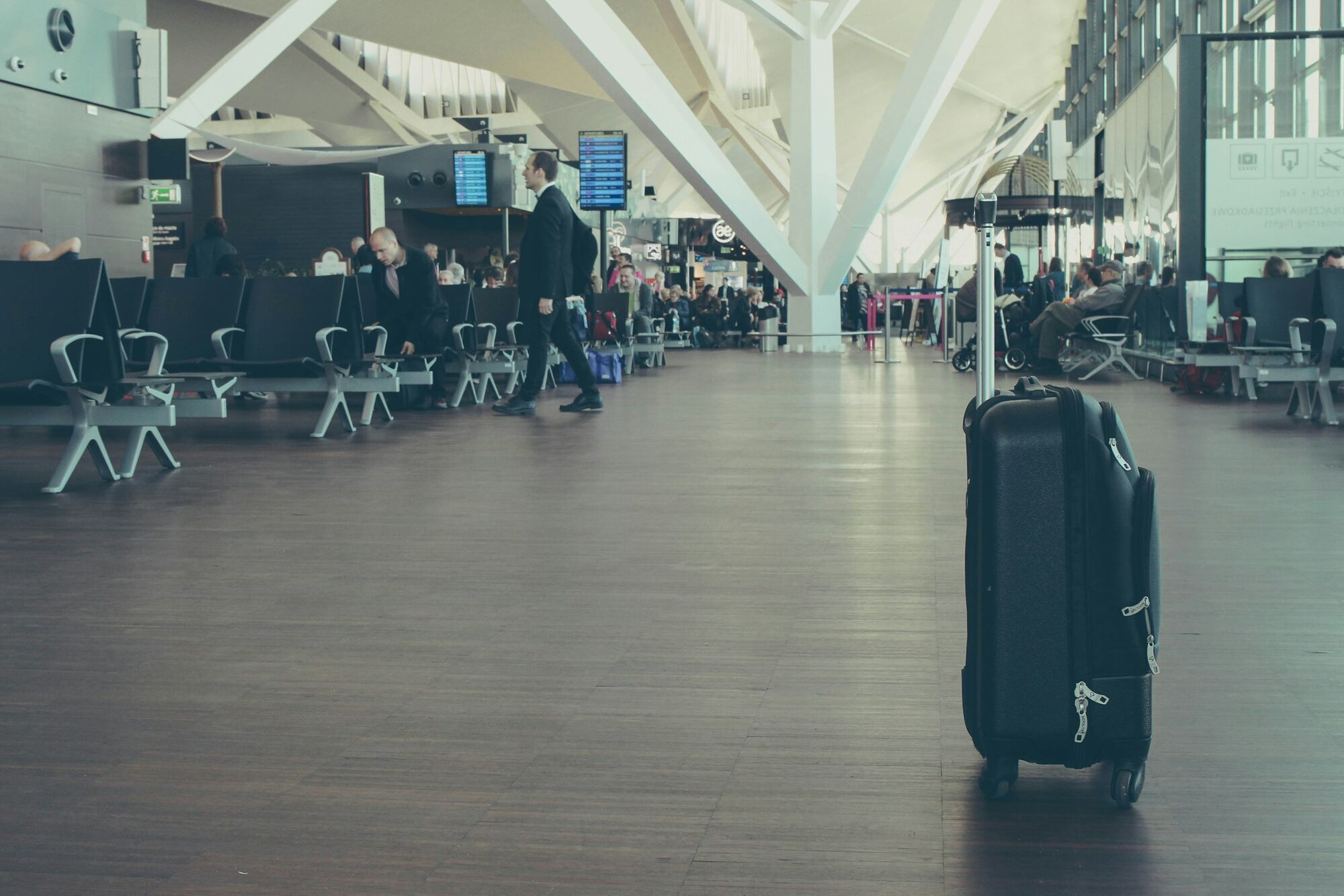 Suitcase standing in an airport terminal