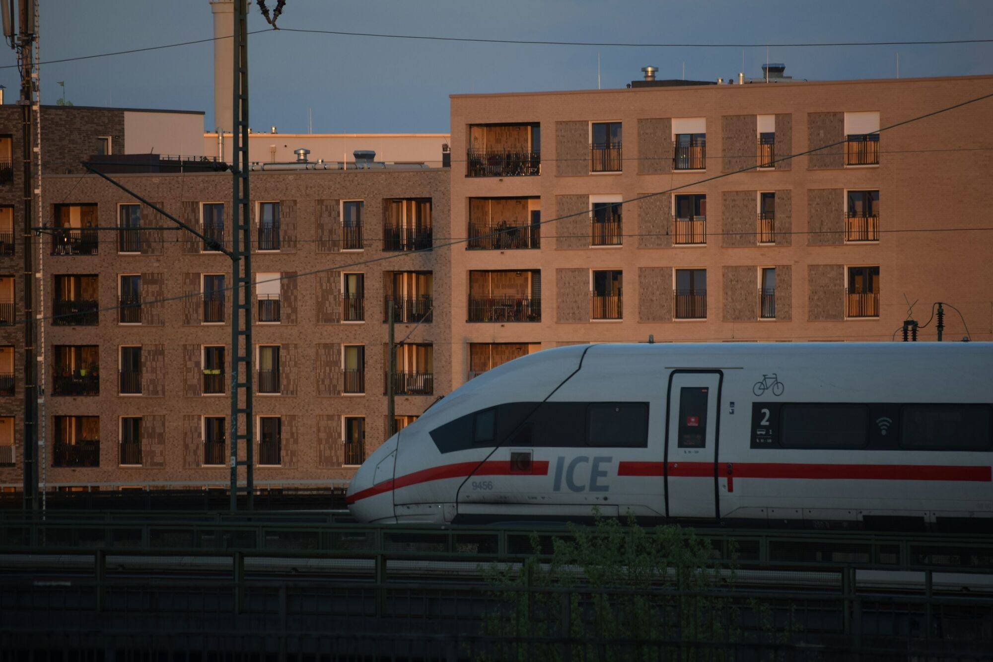 ICE train passing through a station