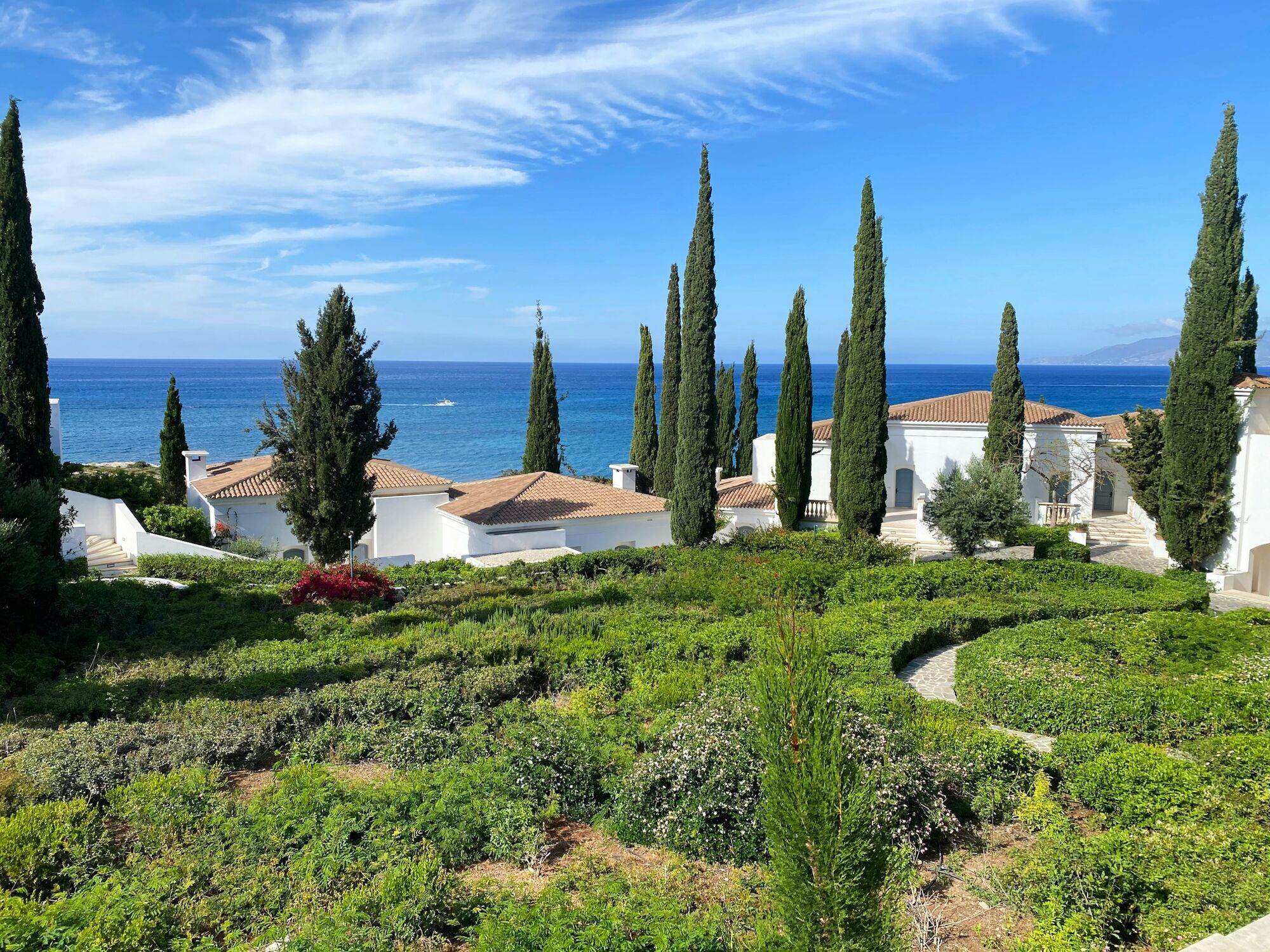 Mediterranean garden with cypress trees overlooking the Cyprus coastline