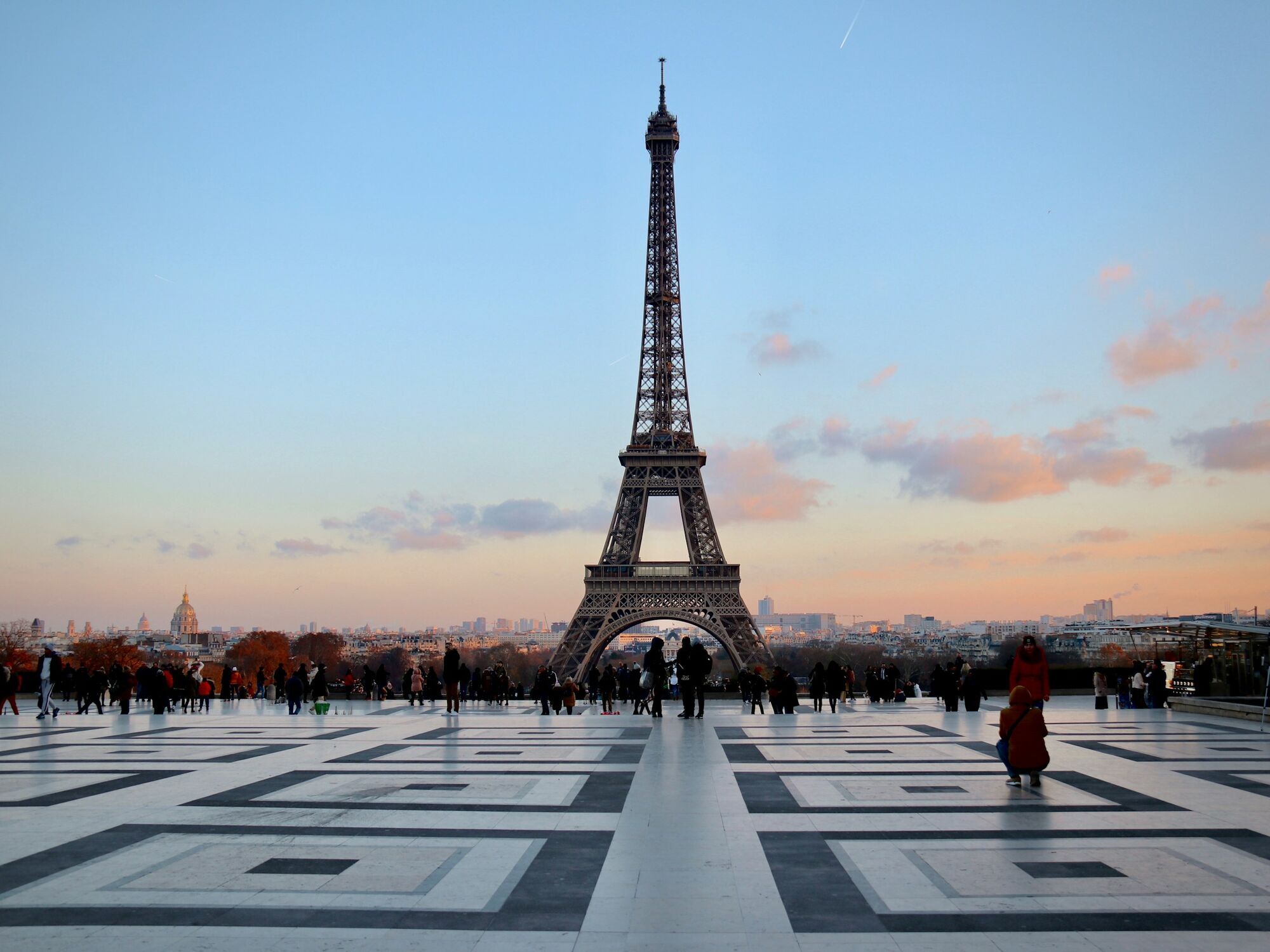 Eiffel Tower at sunset with people in Paris