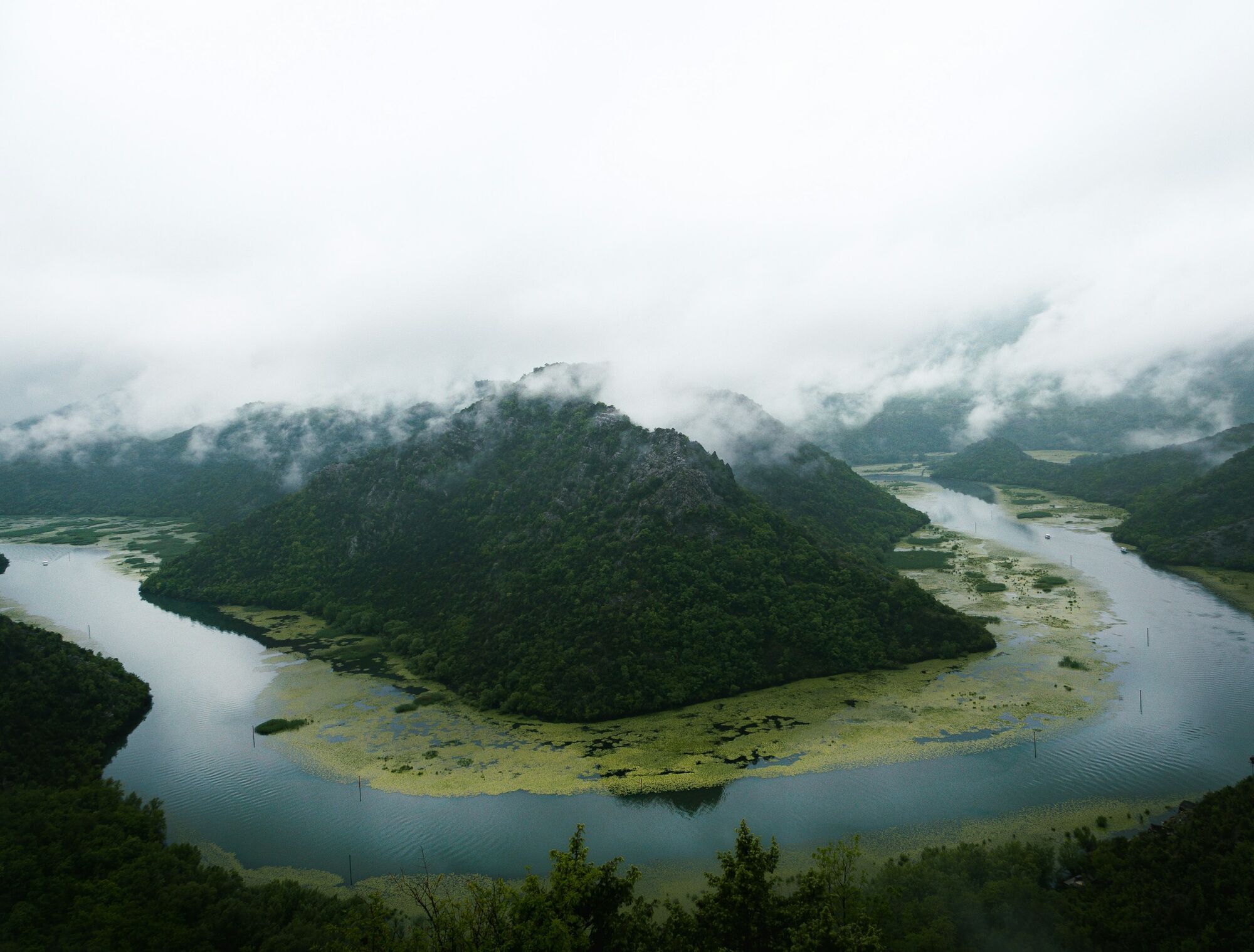 Lake Skadar landscape with mountains and low clouds in Montenegro