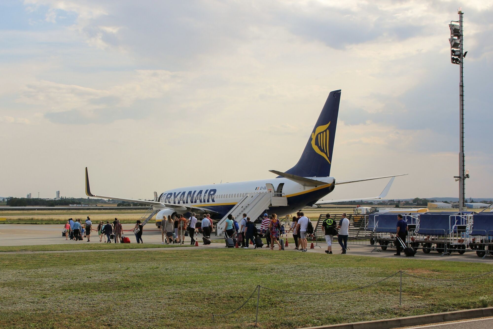 Passengers boarding a Ryanair aircraft on the tarmac
