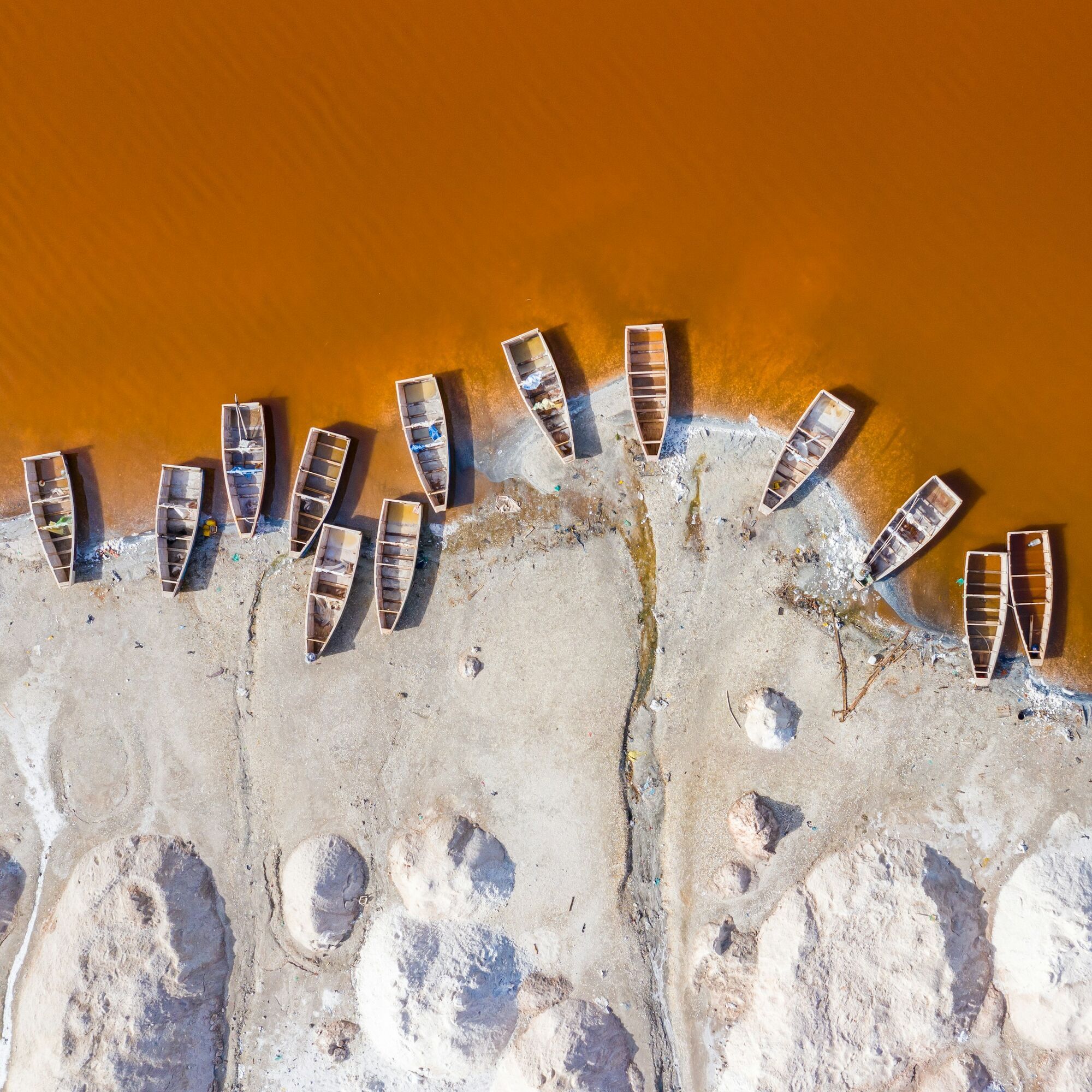Salt landscape and boats at Senegal’s Pink Lake
