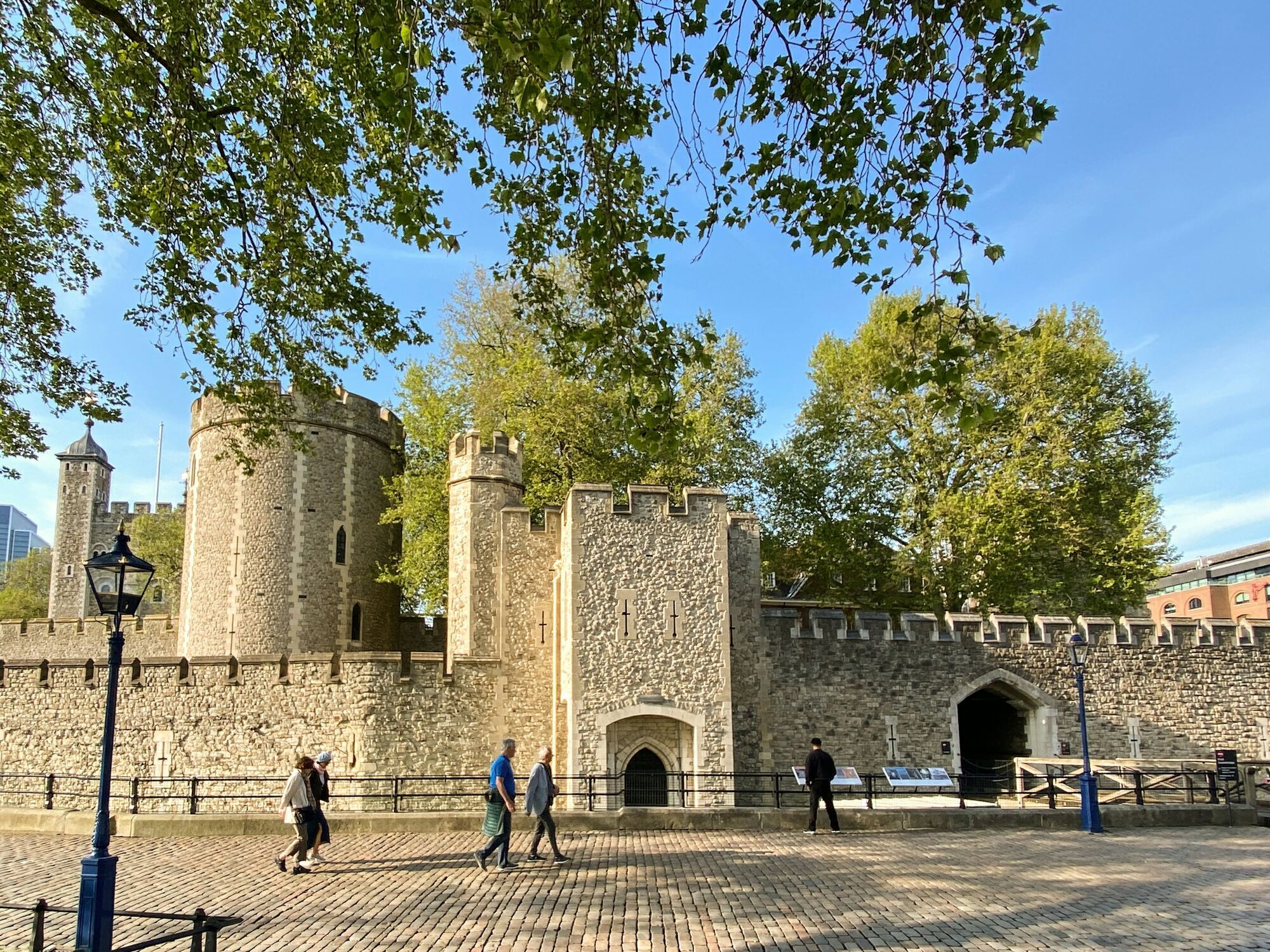 Visitors walking beside the Tower of London