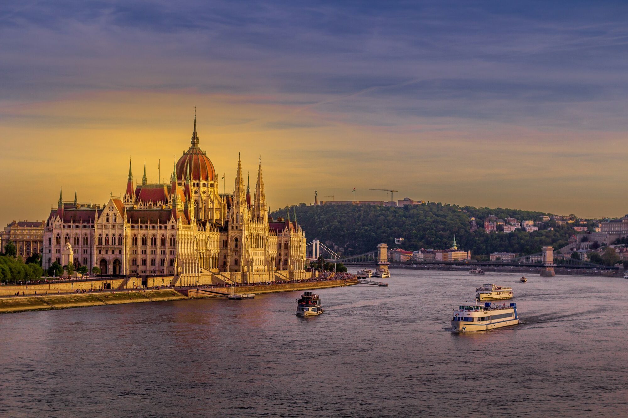 Boats passing the Hungarian Parliament in Budapest