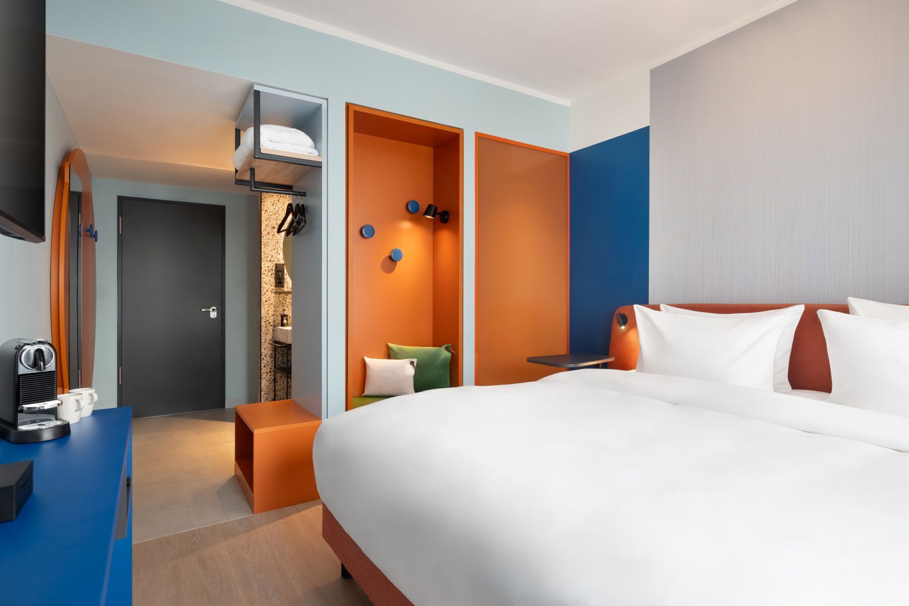 Colourful guestroom at Me and All Hotel Leipzig