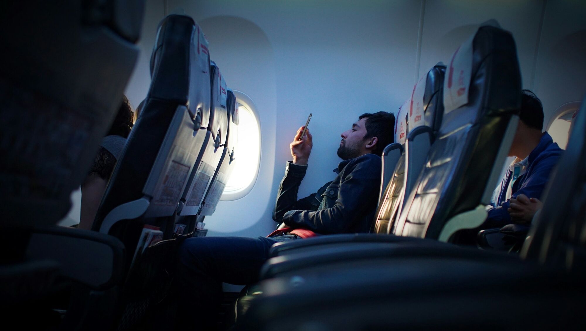 Passenger using a smartphone during a flight