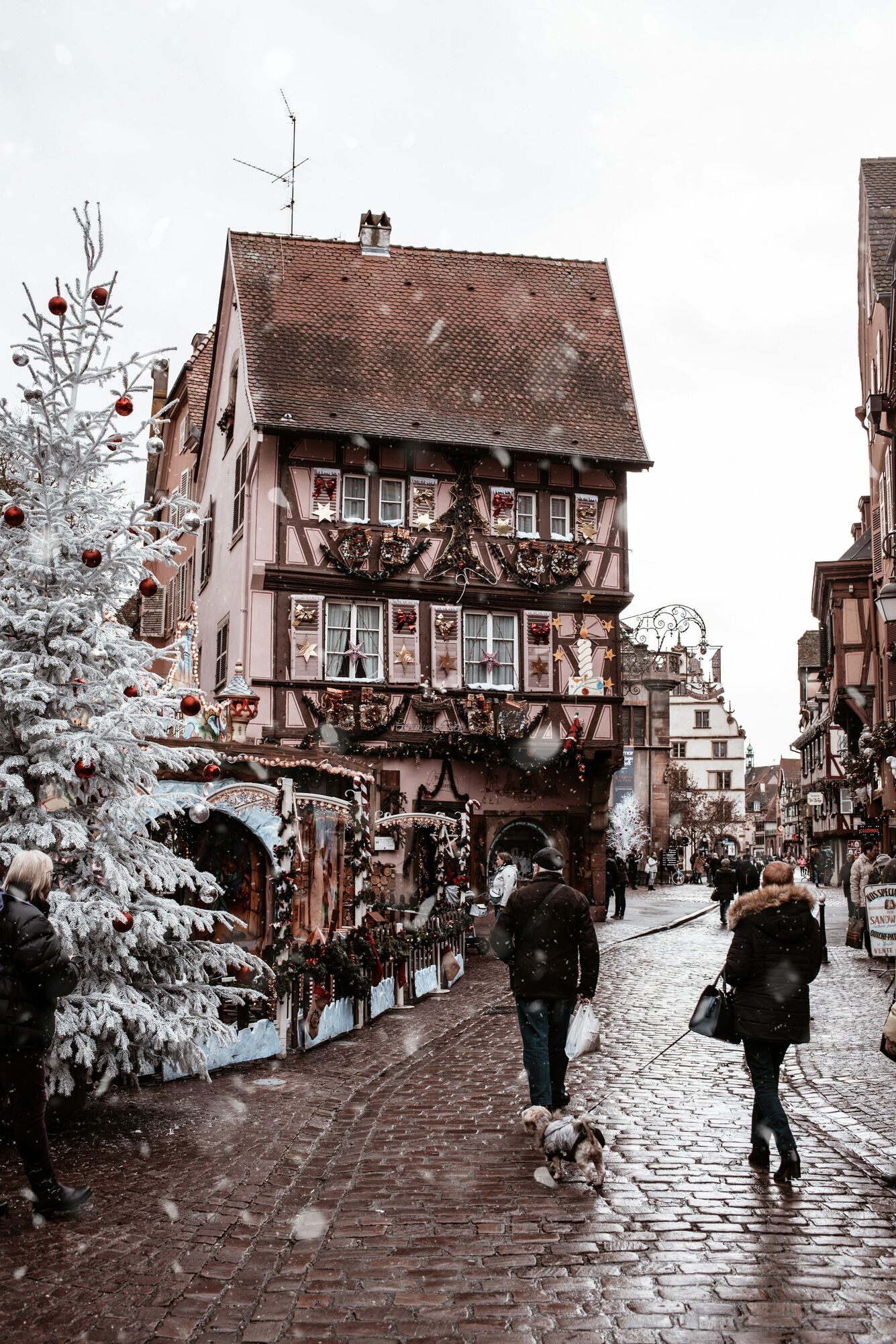 Snowy Christmas market street in Strasbourg