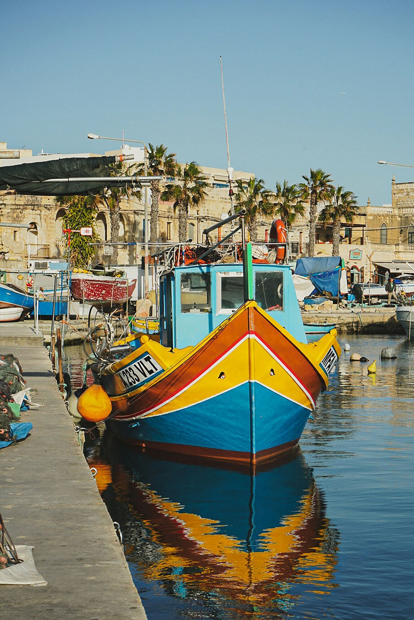 Colourful luzzu fishing boat in Marsaxlokk harbour