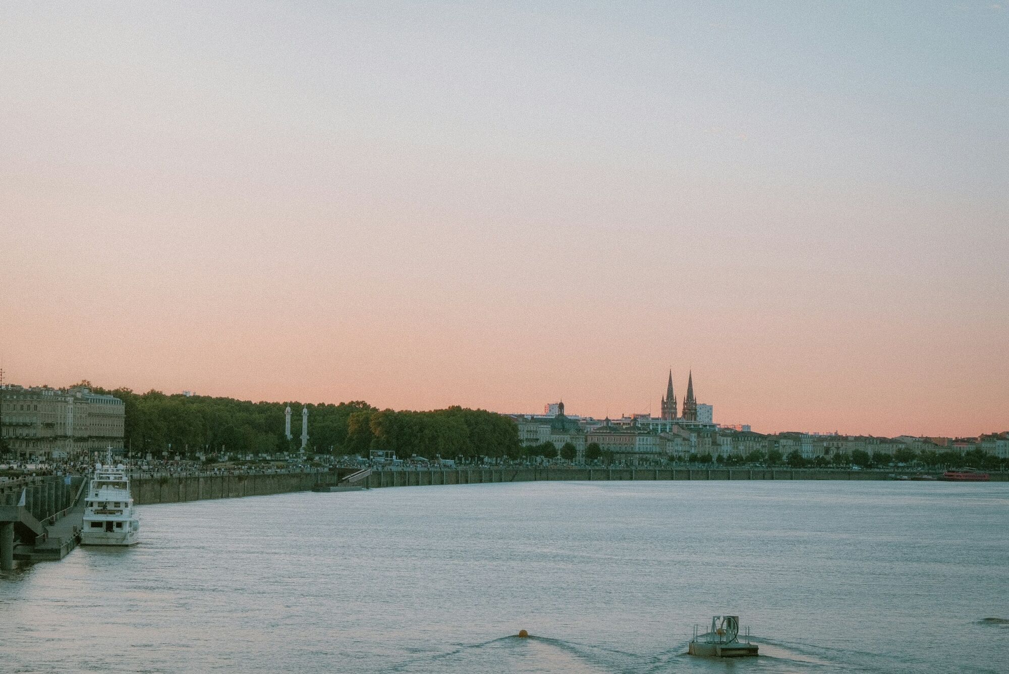 Bordeaux waterfront beneath a hazy sky