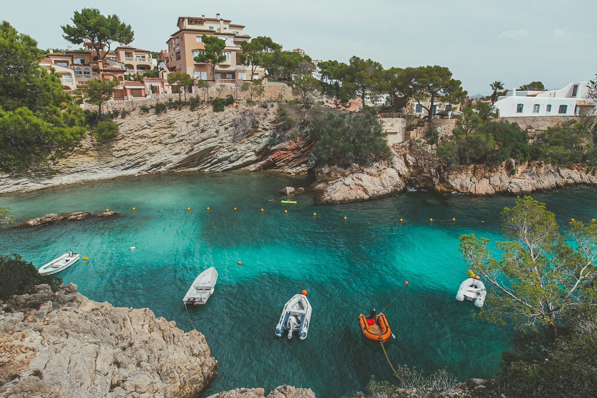Rocky cove with boats in Majorca