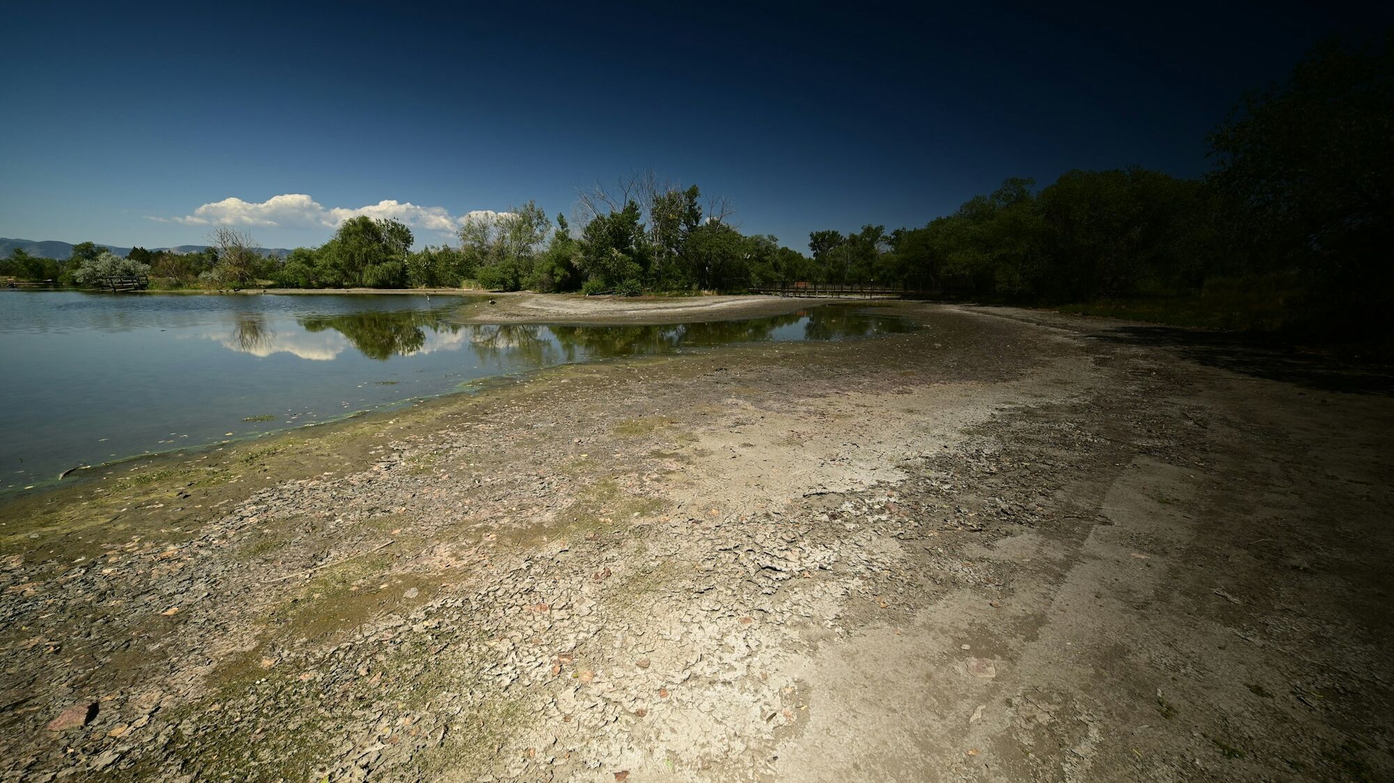 Shrinking lake with exposed cracked shoreline