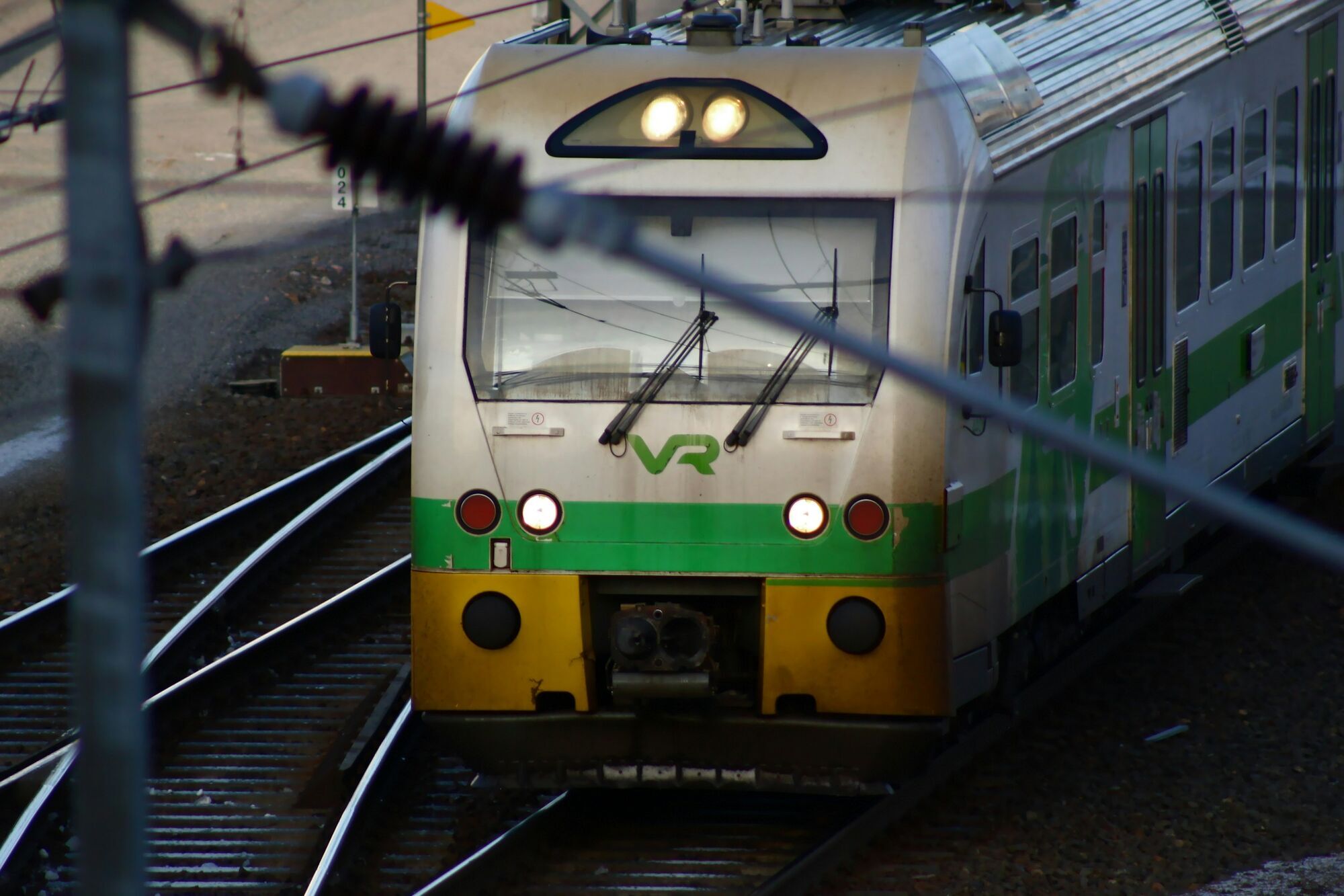 VR passenger train travelling on railway tracks