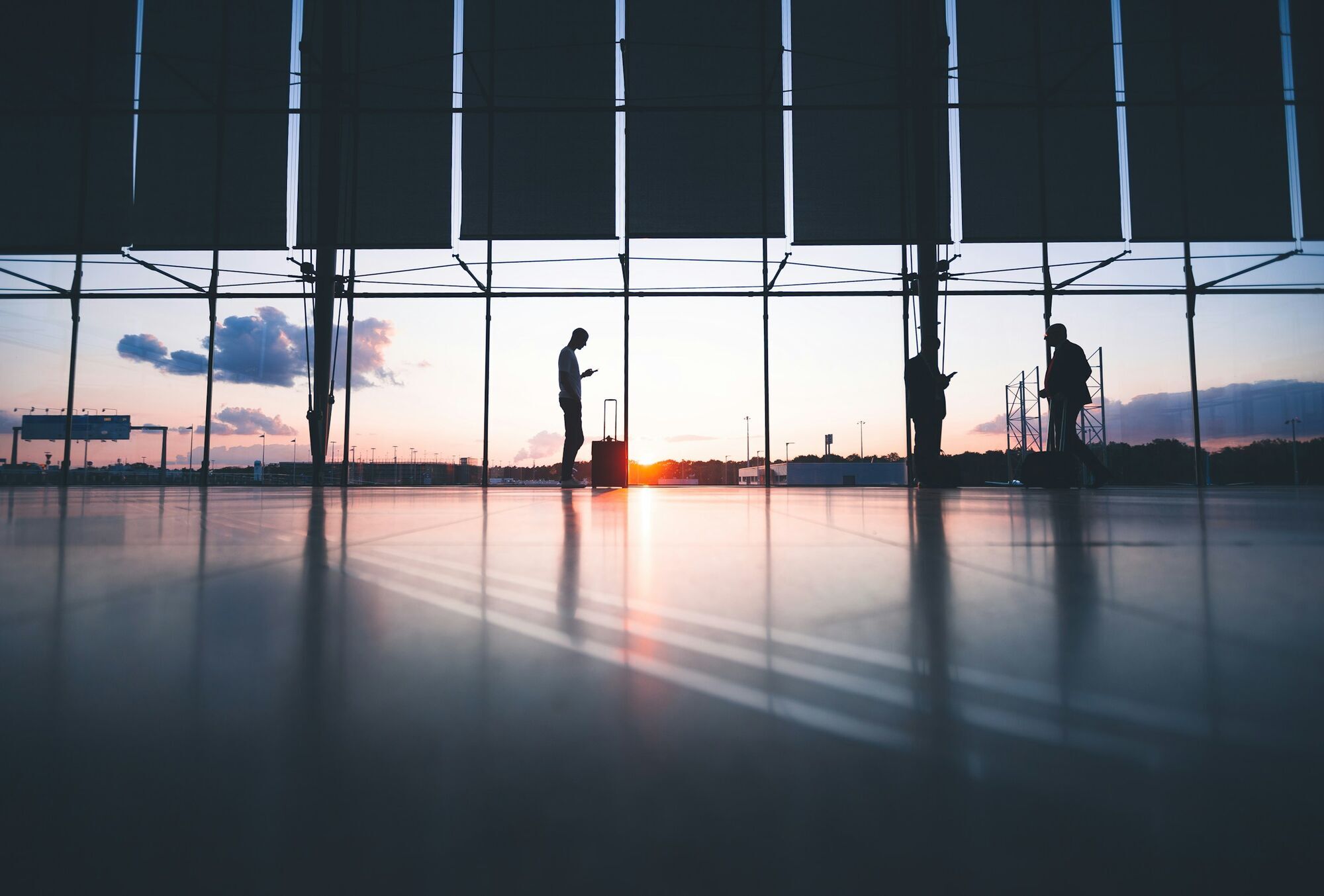 Passengers waiting inside an airport terminal