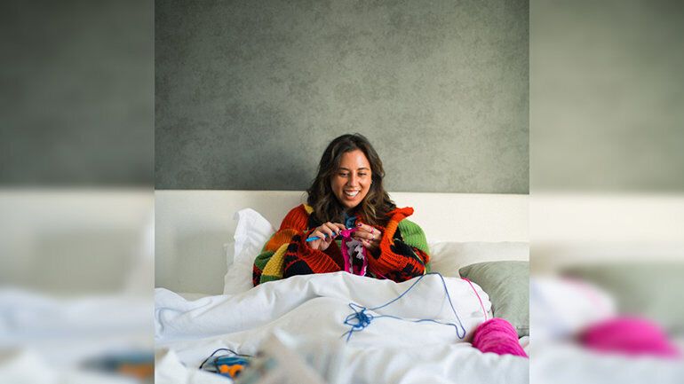 Woman practising a craft during a hotel stay