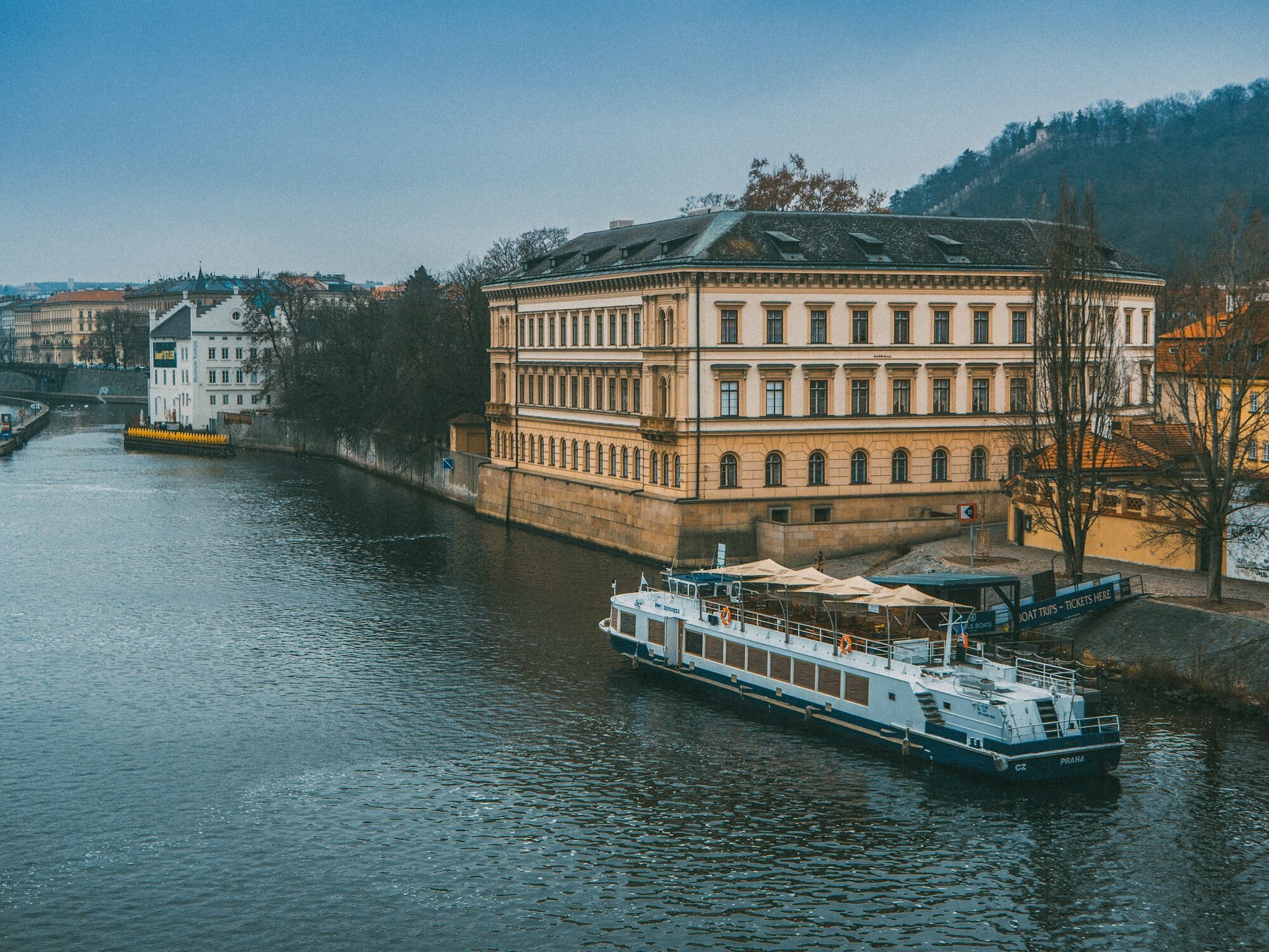 River cruise ship docked beside Prague waterfront