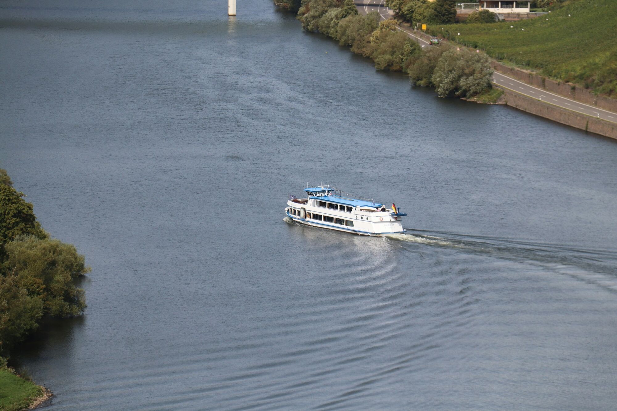 River cruise ship sailing along a European river