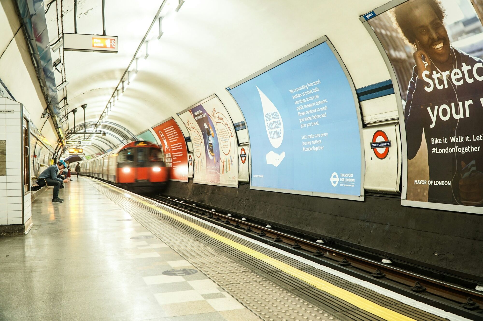 London Underground train arriving at South Kensington station