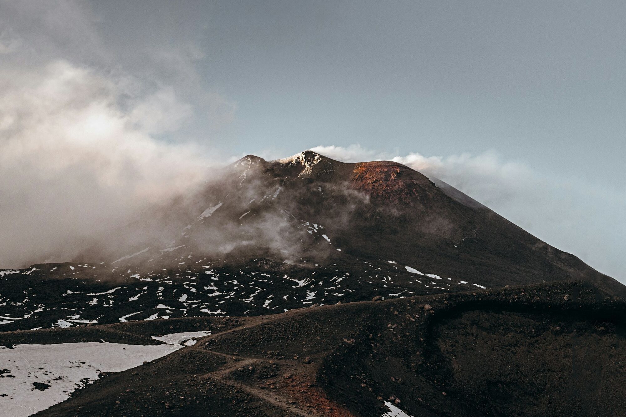 Clouds surrounding the upper slopes of Mount Etna