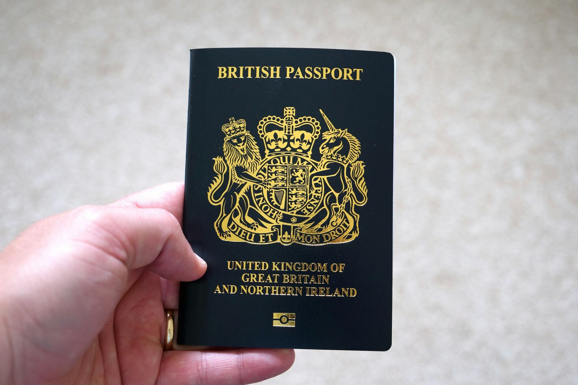 British passport held in one hand