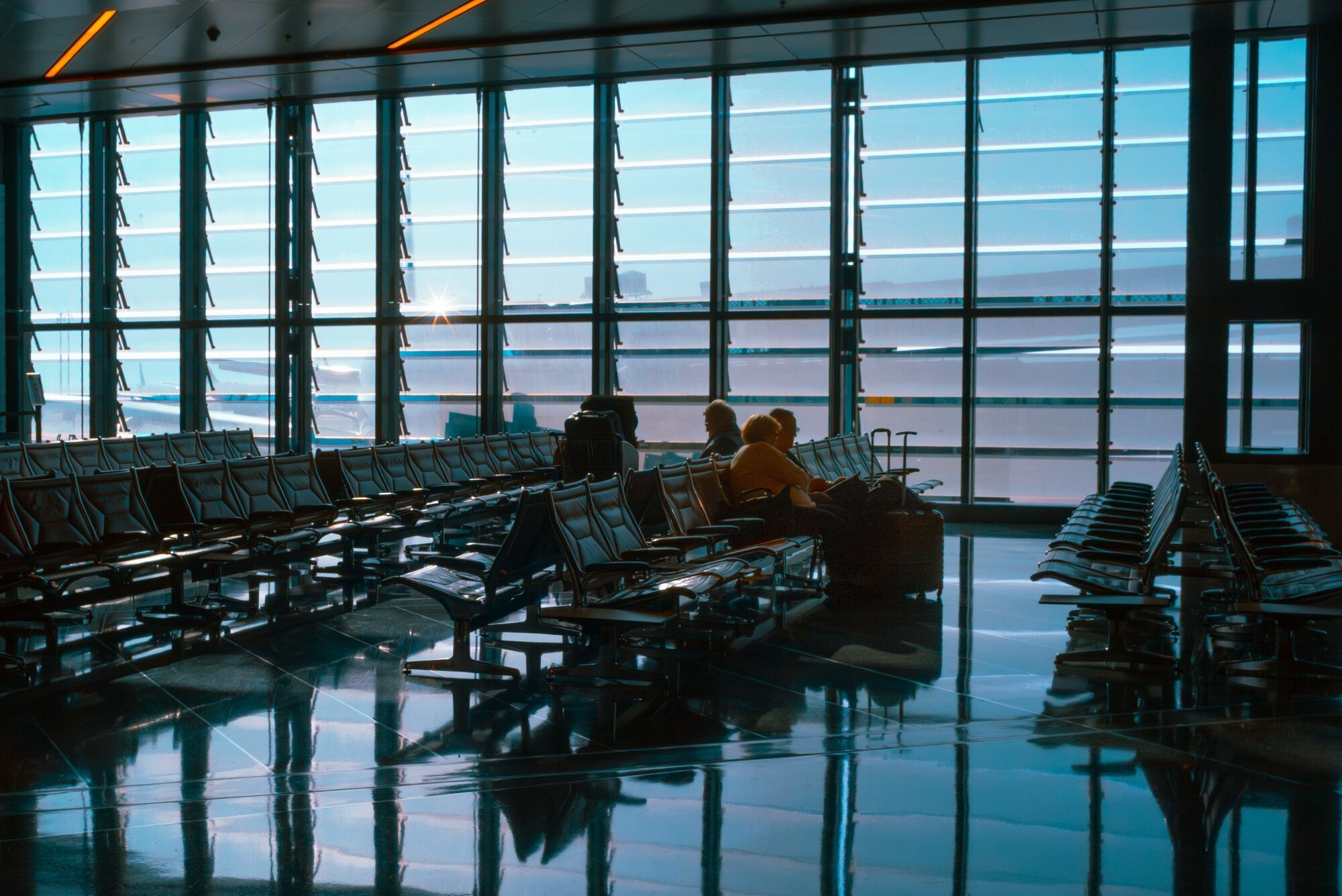 Passengers waiting inside airport terminal