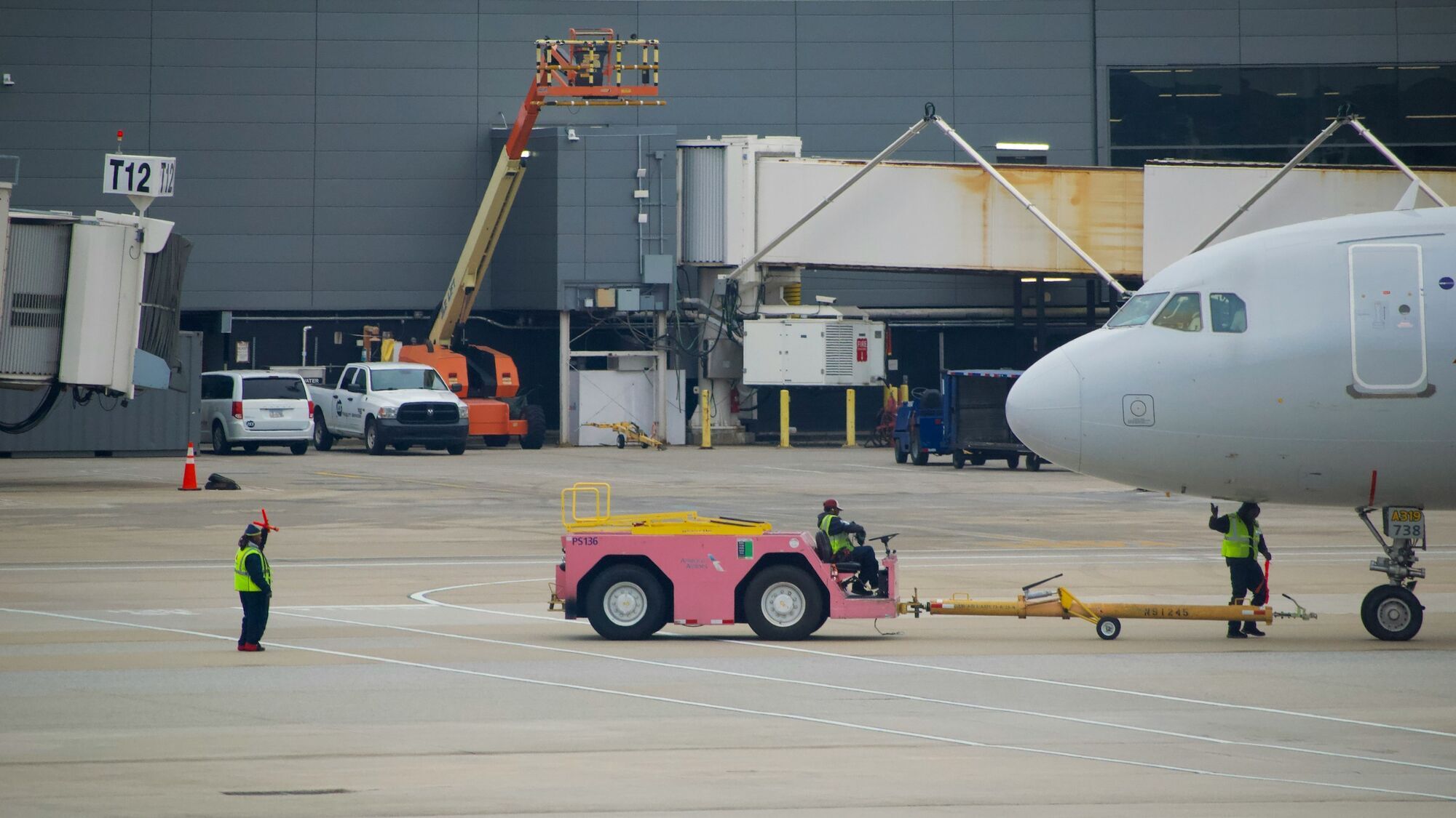 Aircraft connected to airport pushback tug