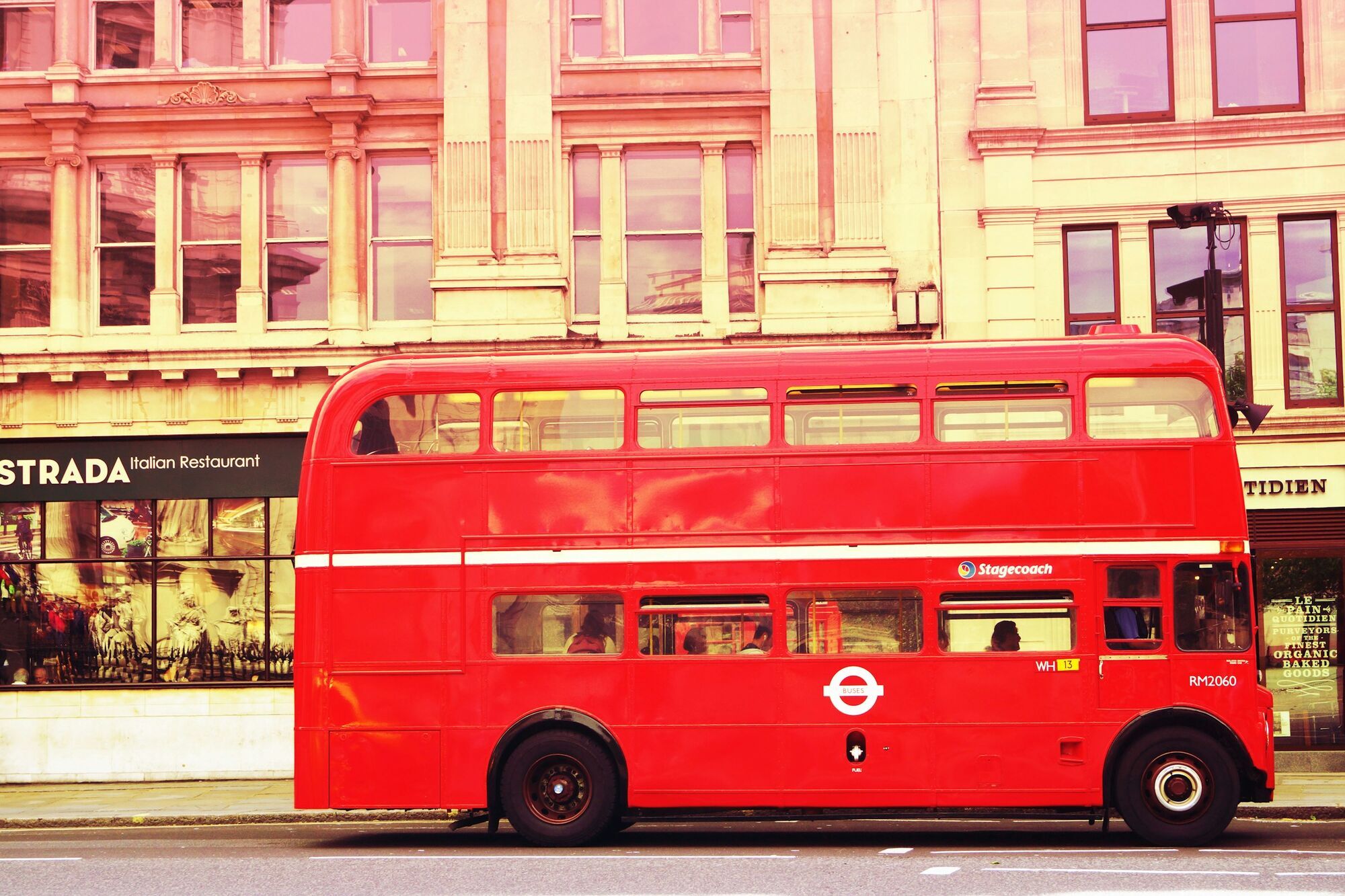 Red double-decker bus on a London street