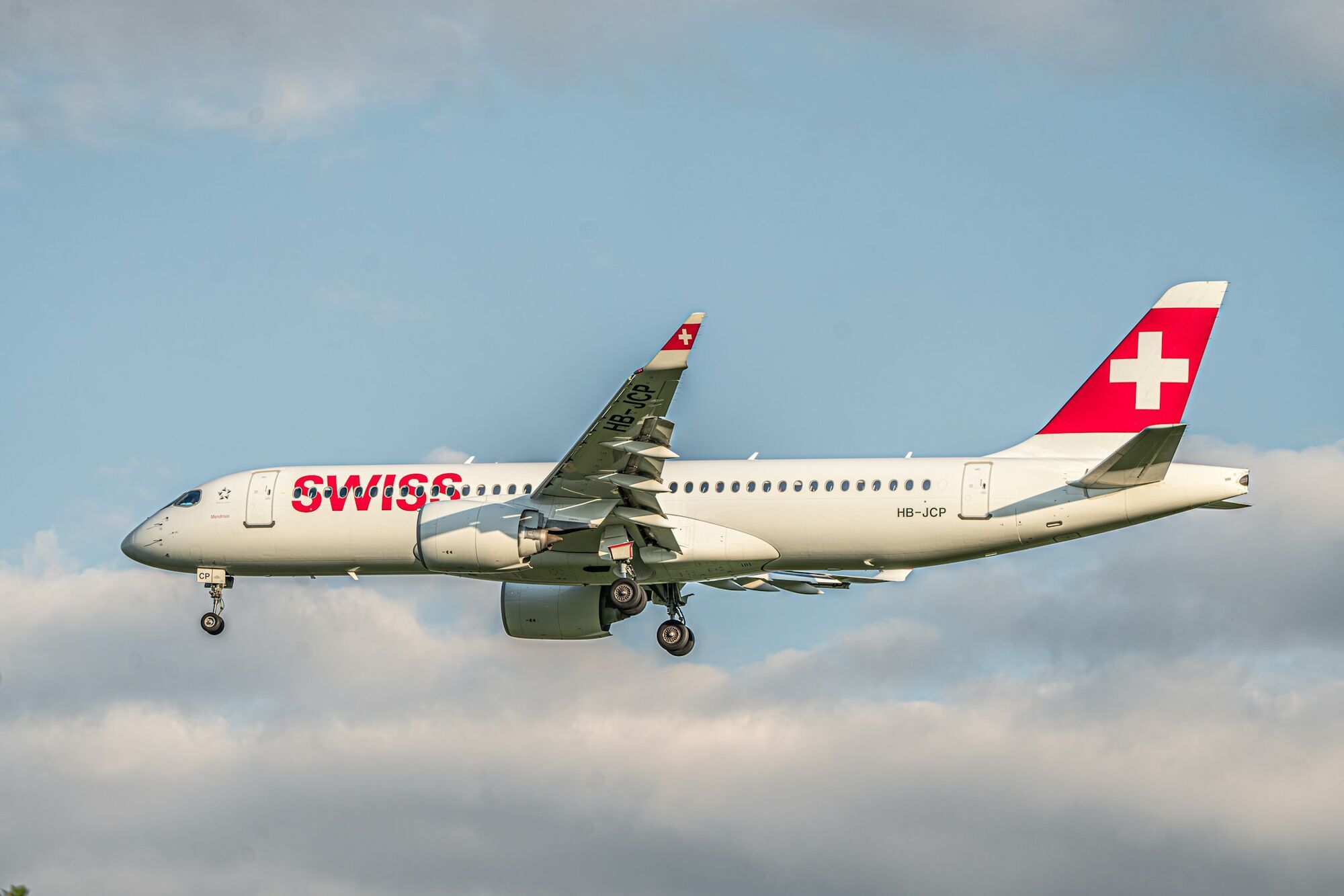SWISS passenger aircraft approaching an airport