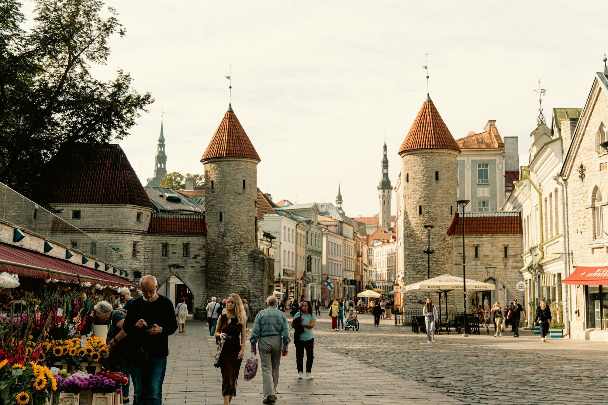 People walking through Tallinn’s historic Viru Gate