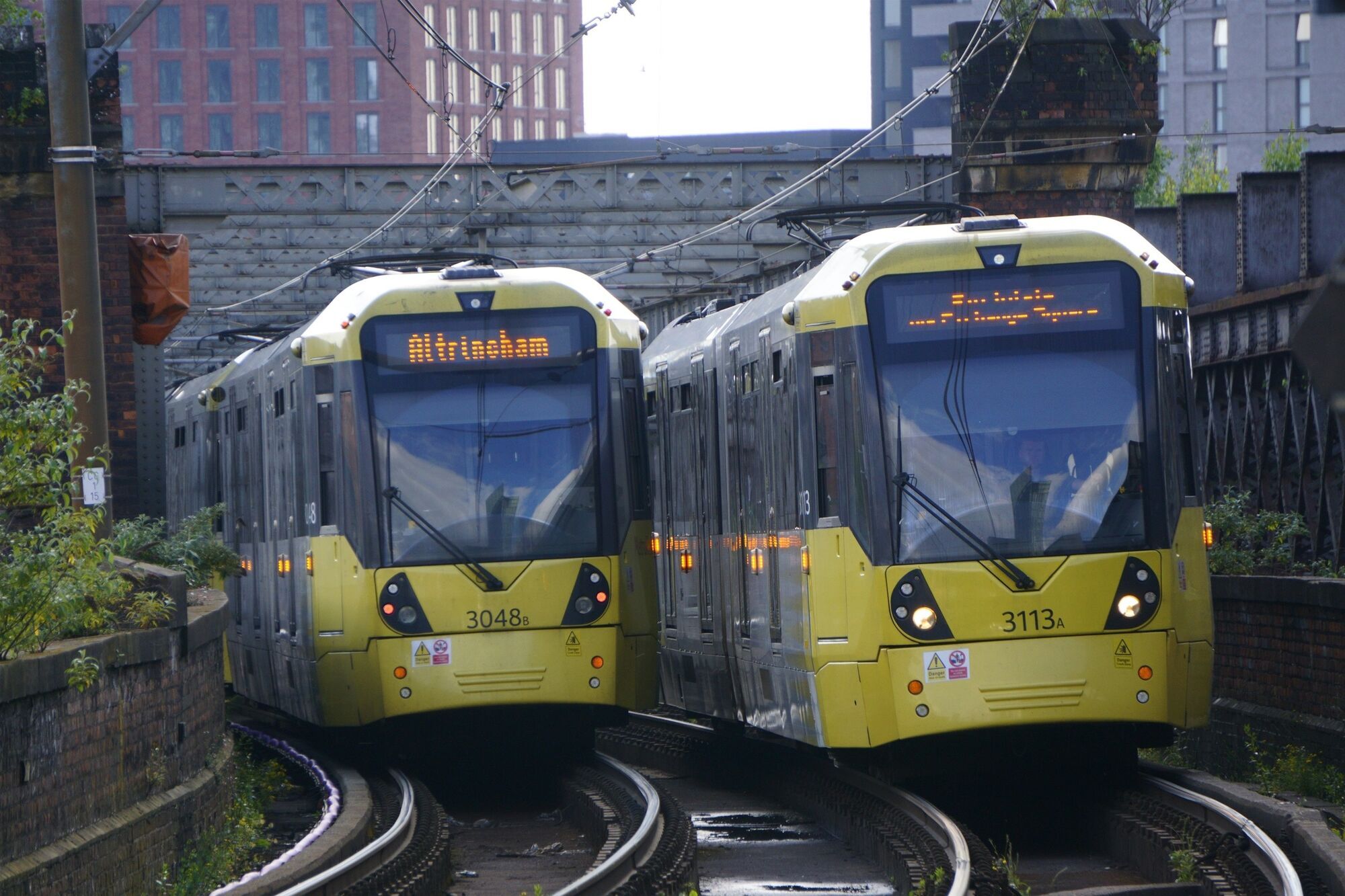 Manchester Metrolink trams on city tracks